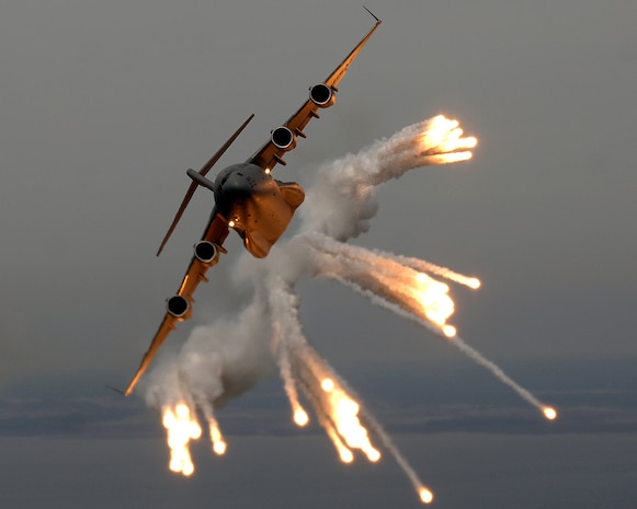 A C-17 Globemaster III from the 14th Airlift Squadron releases flares over the Atlantic Ocean during a local exercise near Charleston May 16, 2006. People will have a chance to see some of Charleston?s C-17s during demonstrations for the 2008 ?Wings Over Charleston? Air Expo here Saturday. (U.S. Air Force photo/Tech. Sgt. Russell Cooley IV)