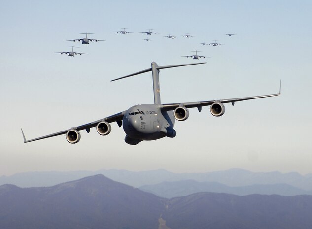 Thirteen C-17 aircraft fly over the Blue Ridge Mountains in Virginia during low-level tactical training Dec. 20, 2005. The C-17s, assigned to the 437th and 315th Airlift Wings at Charleston AFB, demonstrated the Air Force's strategic airdrop capability. (U.S. Air Force photo/Staff Sgt. Jacob Bailey)