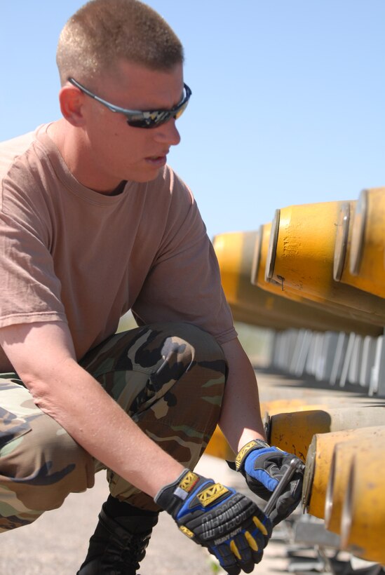 Master Sgt.  Stanley Dermont, a munitions specialist with the 149th Fighter Wing (FW), Texas Air National Guard, San Antonio, Texas, removes the shipping plug from a Mark 82 bomb shell.  MSgt Dermont is deployed to Davis-Monthan Air Force Base, Tucson, Arizona in support of Coronet Cactus, an annual 149FW training exercise.  (Air National Guard photo by SSgt Andre' Bullard) (RELEASED)