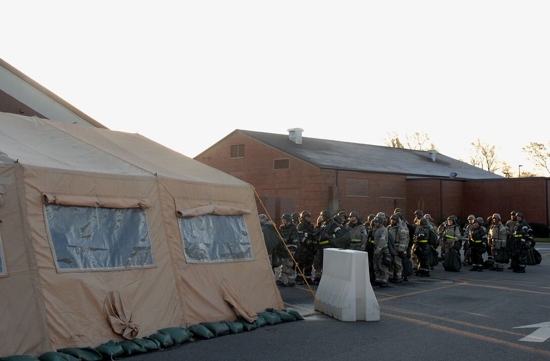 Airmen of the 1st and 192nd Fighter Wings enter an entry control point during an Operational Readiness Inspection April 16.  Airmen were inspected on their ability to survive and operate in a simulated deployed environment.  (U.S. Air Force photo/Senior Airman Vernon Young)