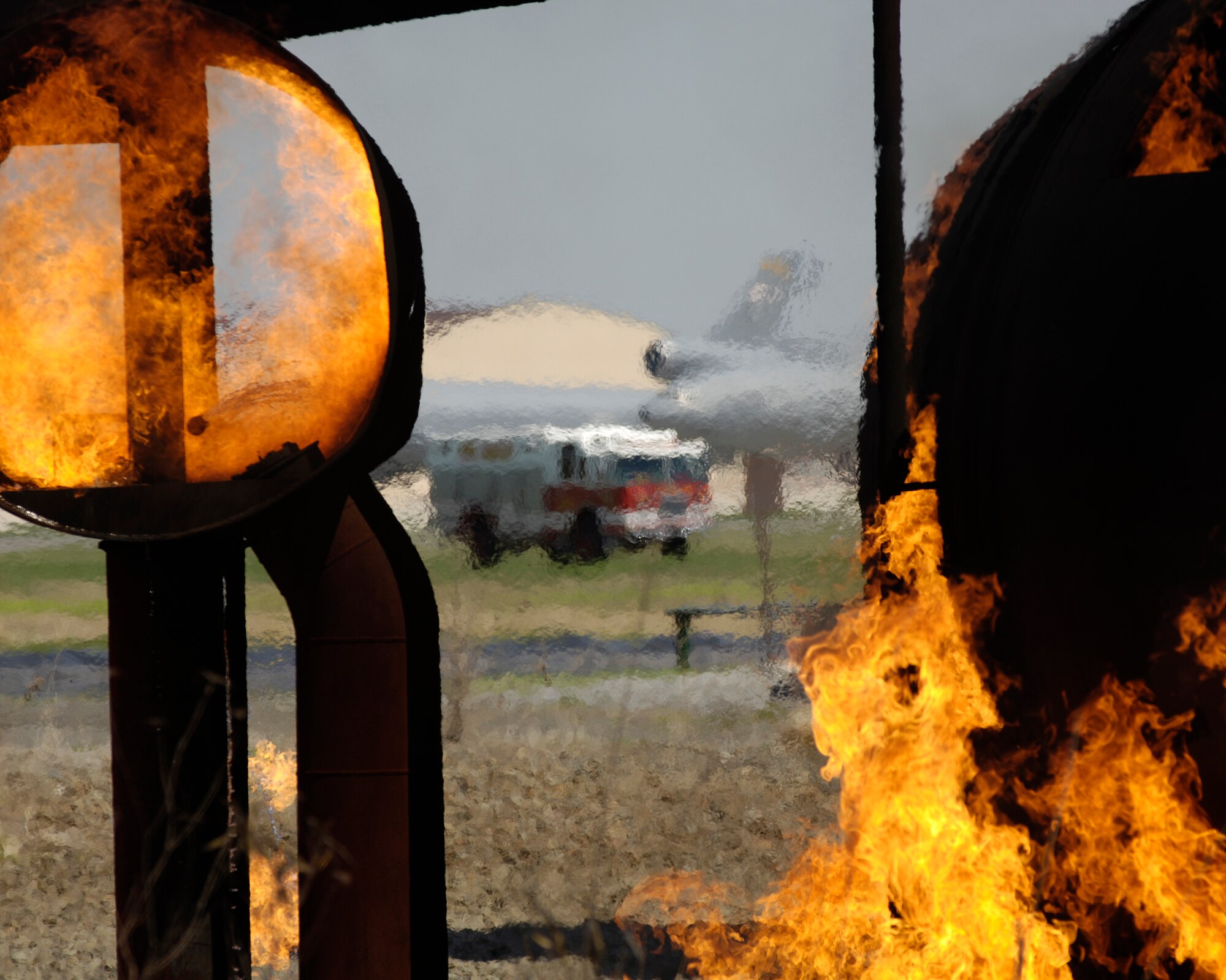 Firefighters from the 305th Civil Engineer Squadron, McGuire Air Force Base, N.J., respond to an aircraft fire during a Major Accident Response Exercise recently. Exercises, like the MARE, prepare McGuire initial responders to be ready for anything. (U.S. Air Force photo/Kenn Mann) 