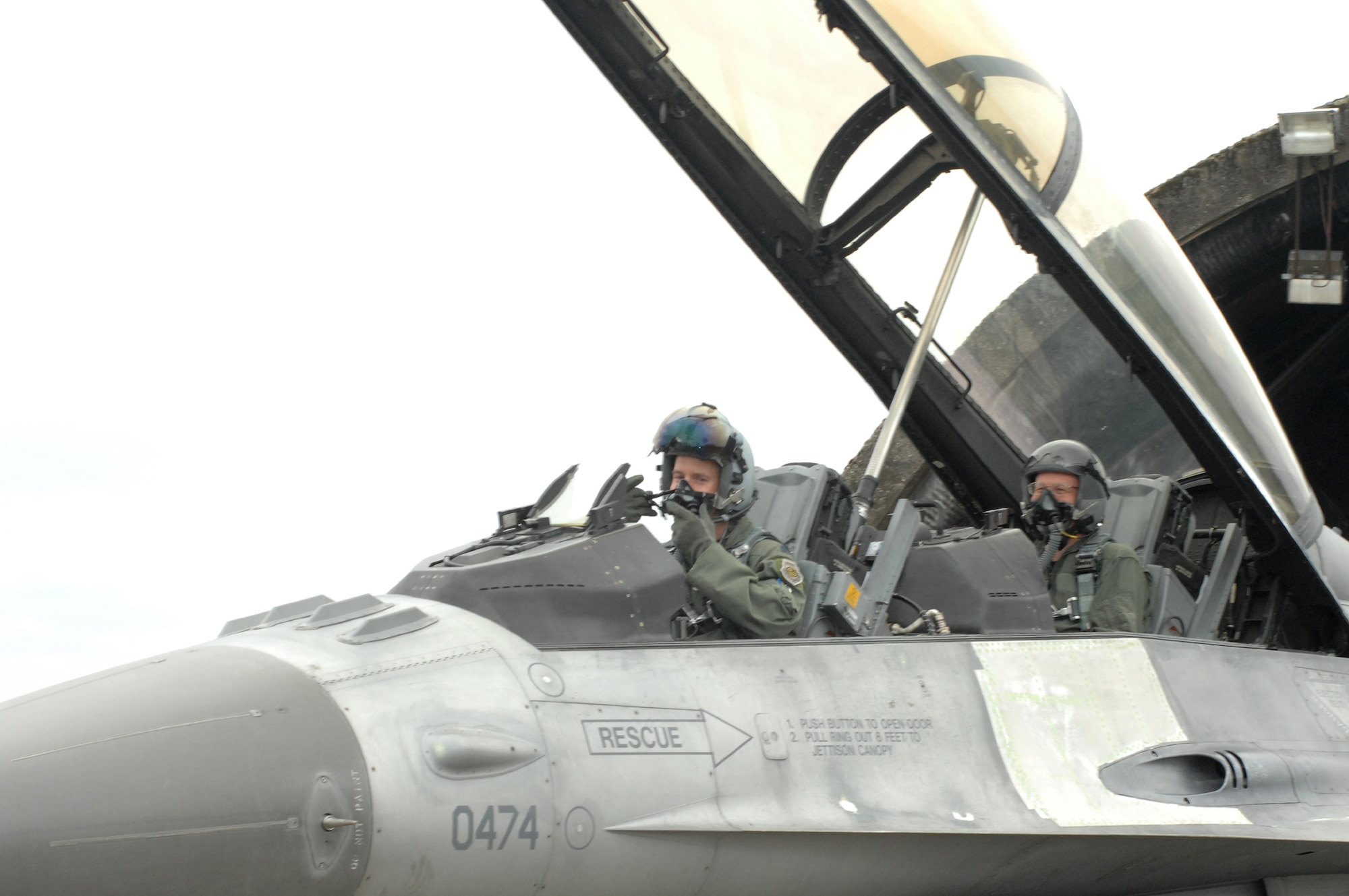 SPANGDAHLEM AIR BASE, Germany -- Lt. Col. Doug “Stoli” Nikolai, 22nd Fighter Squadron commander, and Chief Master Sgt. Vance Clarke, 52nd Fight Wing command chief, prepare for flight in an F-16 Viper. The incentive flight was part of a program to help senior leaders gain a better understanding of the base operations. (U.S. Air Force photo/Senior Airman Logan Tuttle)  