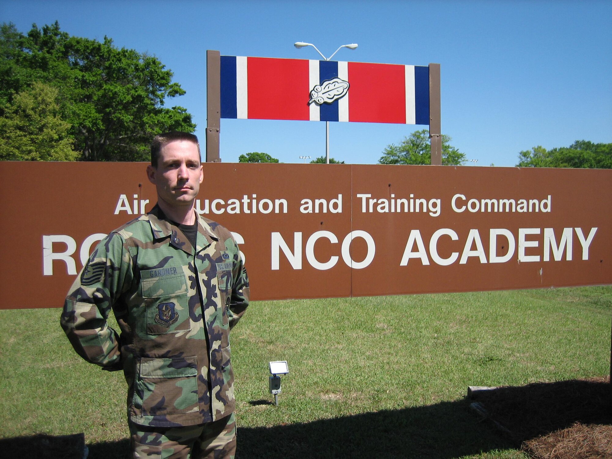SEYMOUR JOHNSON AIR FORCE BASE, N.C. -- Tech. Sgt. Ian Gardner stands at the entrance to the Non-commissioned Officer Academy at Robins Air Force Base, GA. Sergeant Gardner is currently participating in the last class to go through Robins. Sergeant Gardner is a survival equipment repairman with the 916th Operations Support Flight.