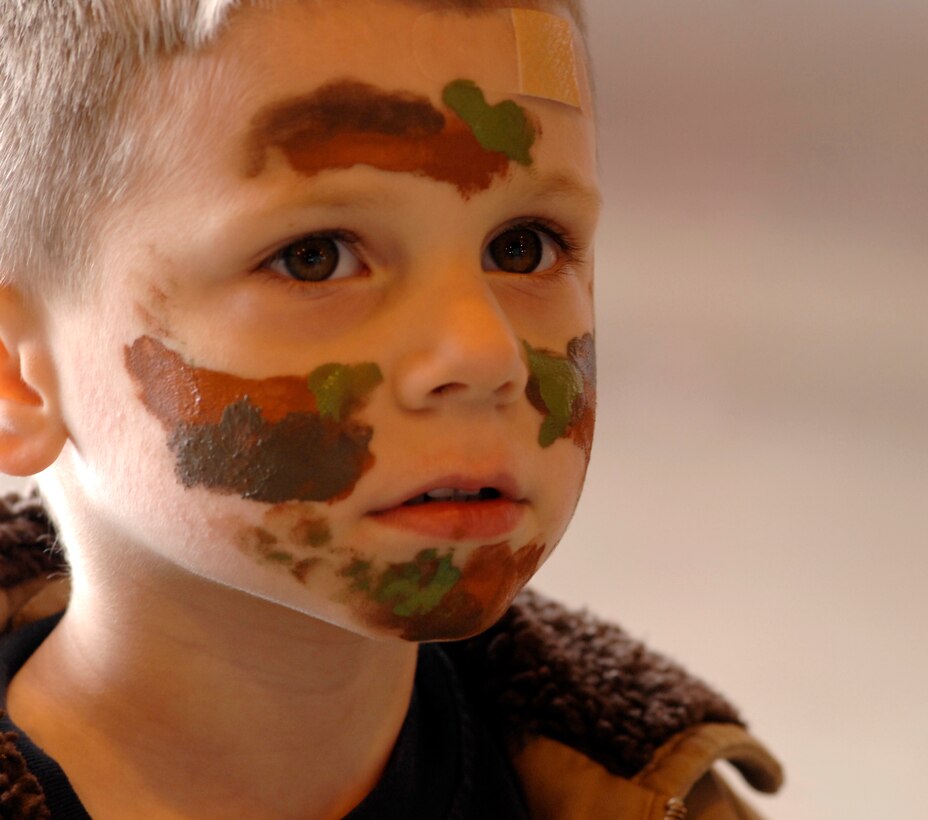 AVIANO AIR BASE, Italy --  Joshua Helm shows off his warrior face paint during Aviano's Children's deployment April 17.  The mock deployment helps military children understand their parents' deployment.  (U.S. Air Force photo/Airman 1st Class Ashley Wood)