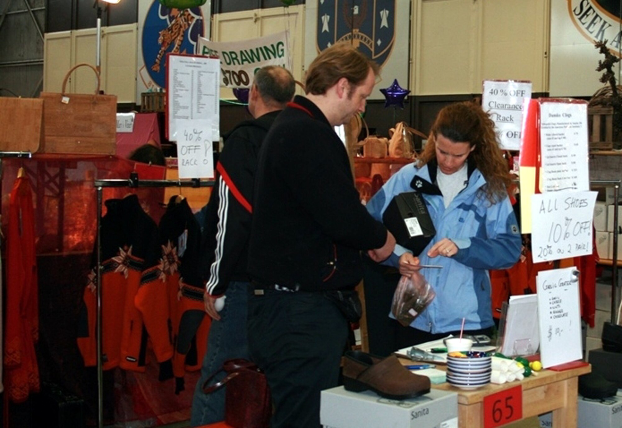 SPANGDAHLEM AIR BASE, Germany – A customer shops for a deal on shoes during the base spring bazaar. The bazaar featured items ranging from cheese and chocolate to paintings and rugs from across Europe.  (U.S. Air Force photo/Virginia Phillips)