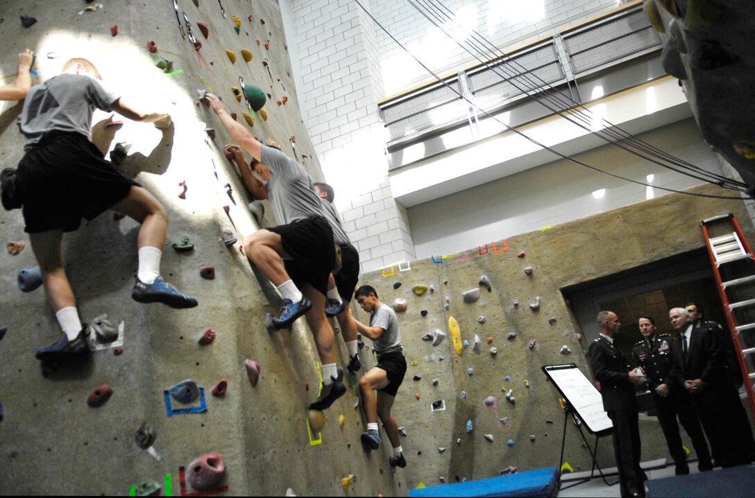 Defense Secretary Robert M. Gates watches cadets climb a rock wall at the Physical Development Center at the United States Military Academy at West Point, N.Y., April 21, 2008.  
