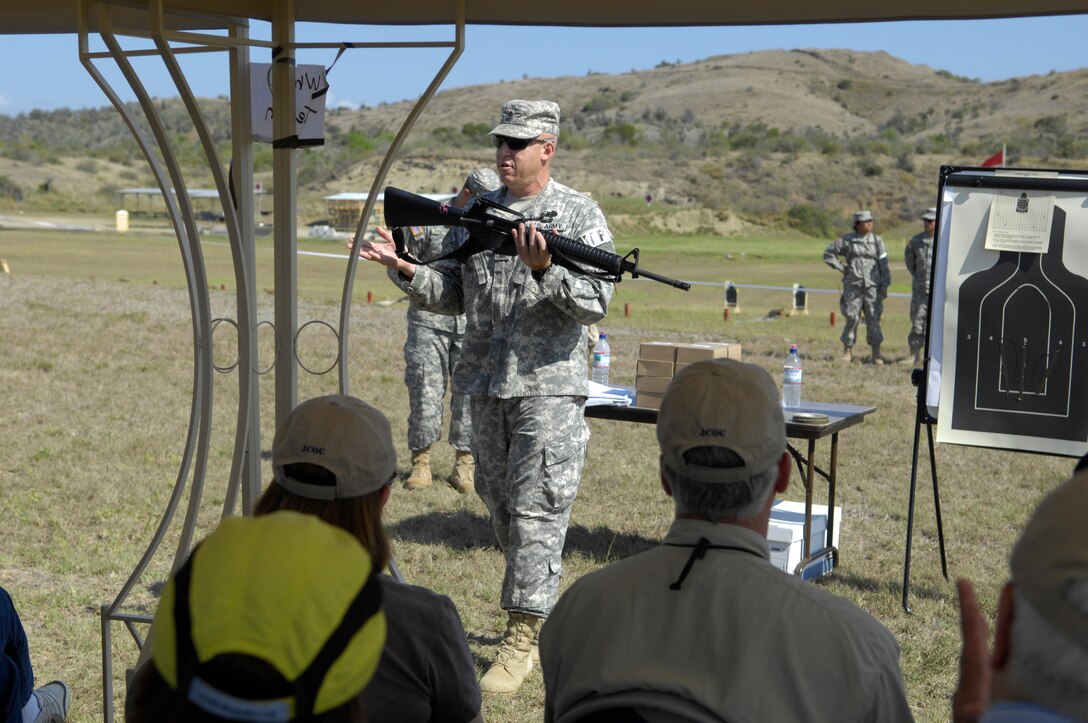 U.S. Army 1st Sgt. Mark Sanchez goes over proper M-16 A-2 procedures with participants of the 75th Joint Civilian Orientation Conference, Guantanamo Bay, Cuba, April 19, 2008.   