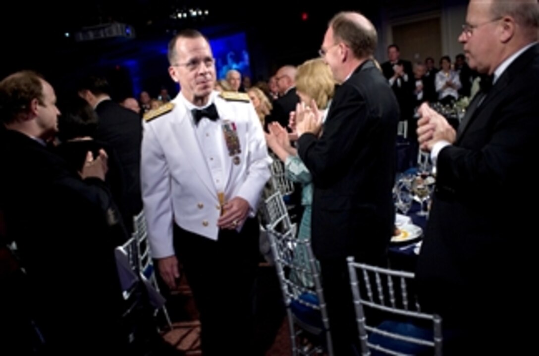 U.S. Navy Adm. Mike Mullen, chairman of the Joint Chiefs of Staff, walks to the stage to receive the Atlantic Council of the United States Distinguished Military Leadership Award, April 21, 2008. 