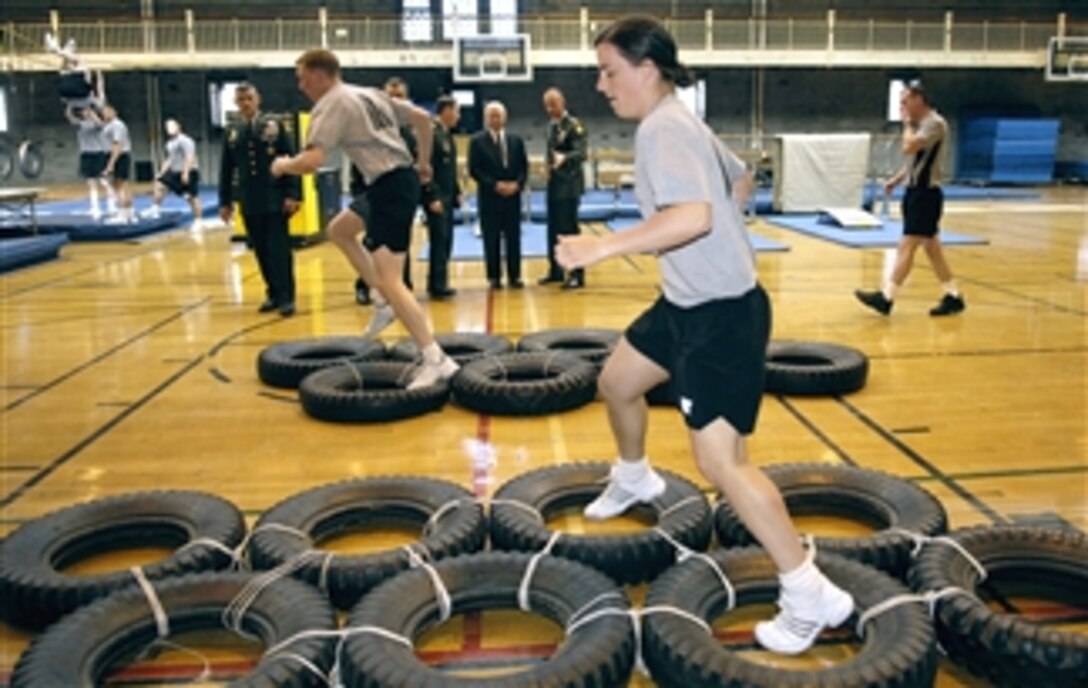 Defense Secretary Robert M. Gates watches cadets maneuver through an obstacle course at the Physical Development Center at the United States Military Academy at West Point, N.Y., April 21, 2008.