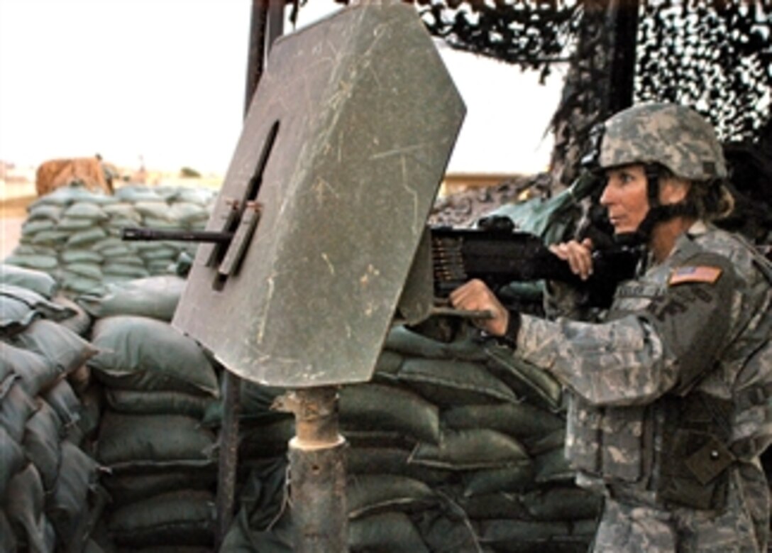 U.S. Air Force Tech. Sgt. Kelly Beeler stands post in one of the many guard towers on Kirkuk Regional Air Base, Iraq. Beeler is assigned to the 506th Expeditionary Security Forces Squadron.
 