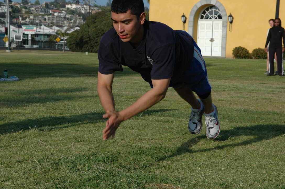 Coast Guard Ensign Marc A. Mares, Sector San Diego, does a clapping push-up as part of Boot Camp Extreme.