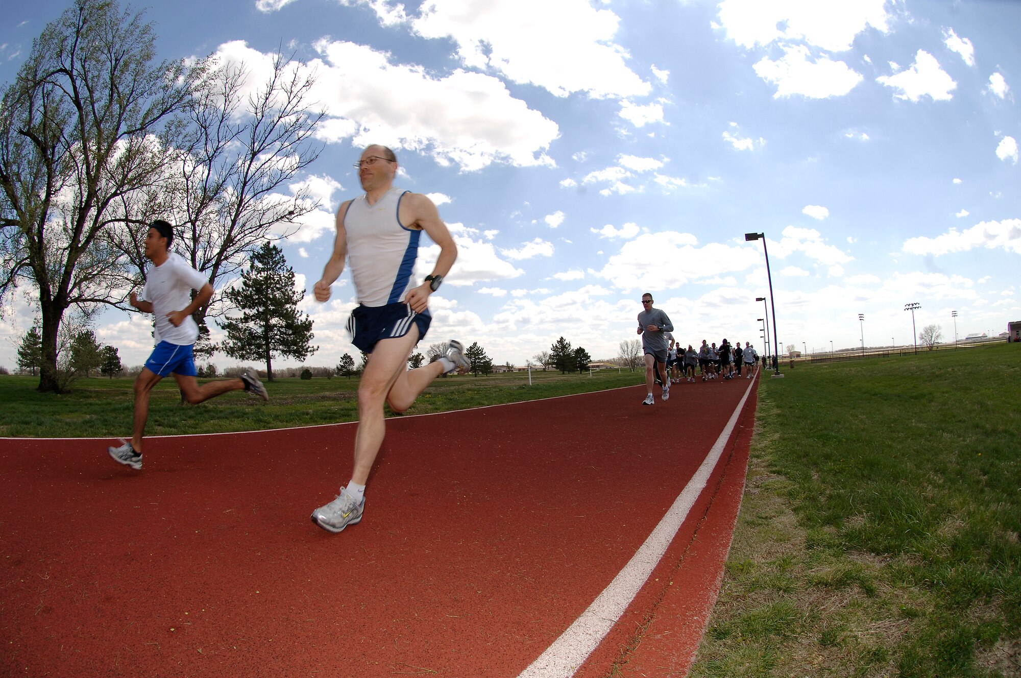 MCCONNELL AIR FORCE BASE, Kan. -- Team McConnell members kick off the start of a 5K run, to raise money for the Air Force Assistance Fund, April 18. The runners raised a total of $410, which would go toward the base goal of $39,644. (Photo by Senior Airman Jamie Train)