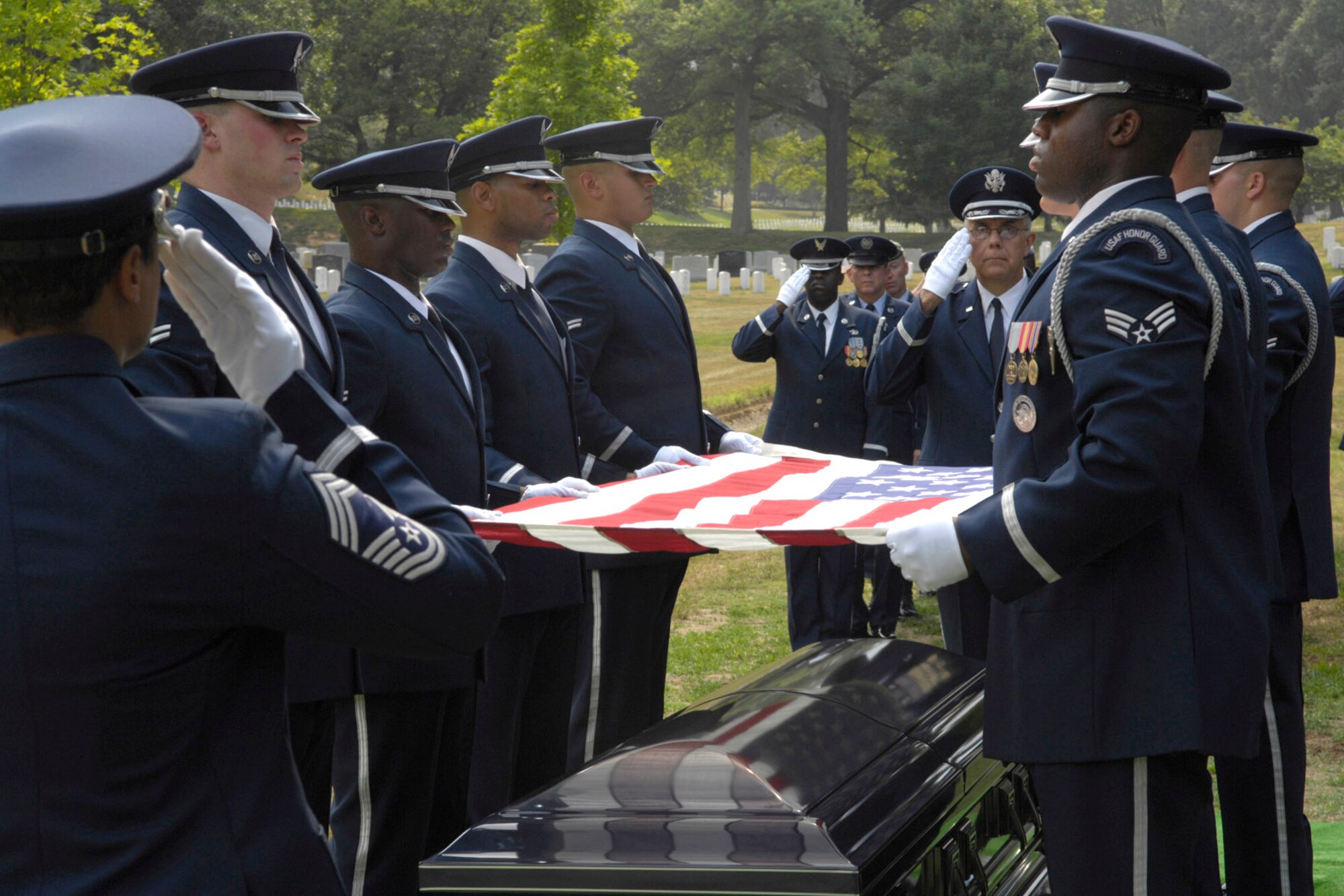 Members of the Air Force Honor Guard render final military honors during burials at Arlington Cemetery.  They also represent the Air Force at official military and state functions.  Officials are seeking experienced NCOs to join the unit to mentor young Airmen serving in the Honor Guard.  (U.S. Air Force photo by Senior Airman Rusti Caraker)