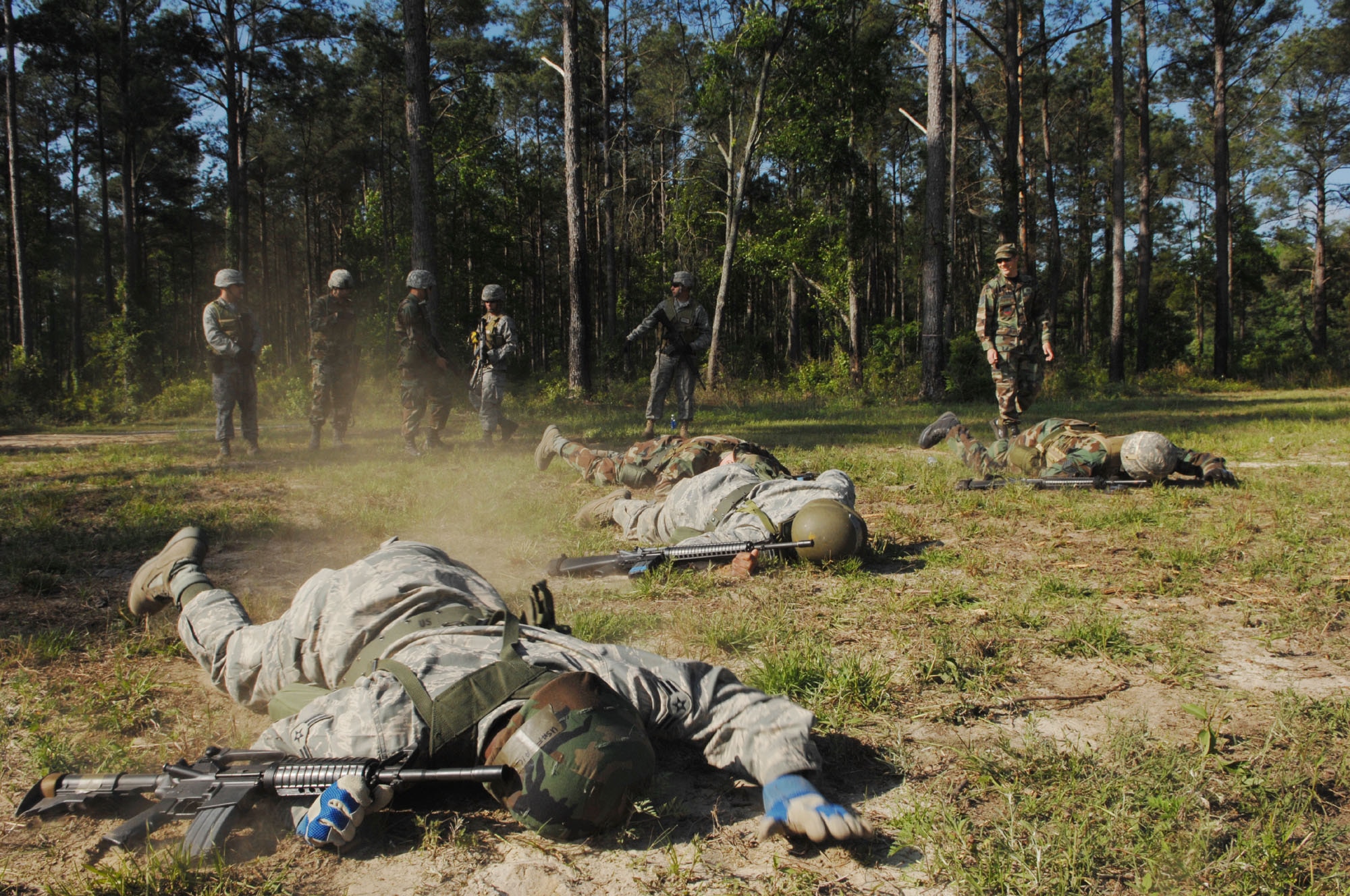 MOODY AIR FORCE BASE, Ga. – Members from the 23rd Civil Engineering Squadron low crawl during a field exercise here April 23.  This exercise will prepare Airman for techniques they could use during an enemy attack. (U.S. Air Force photo by Senior Airman Angelita Lawrence)