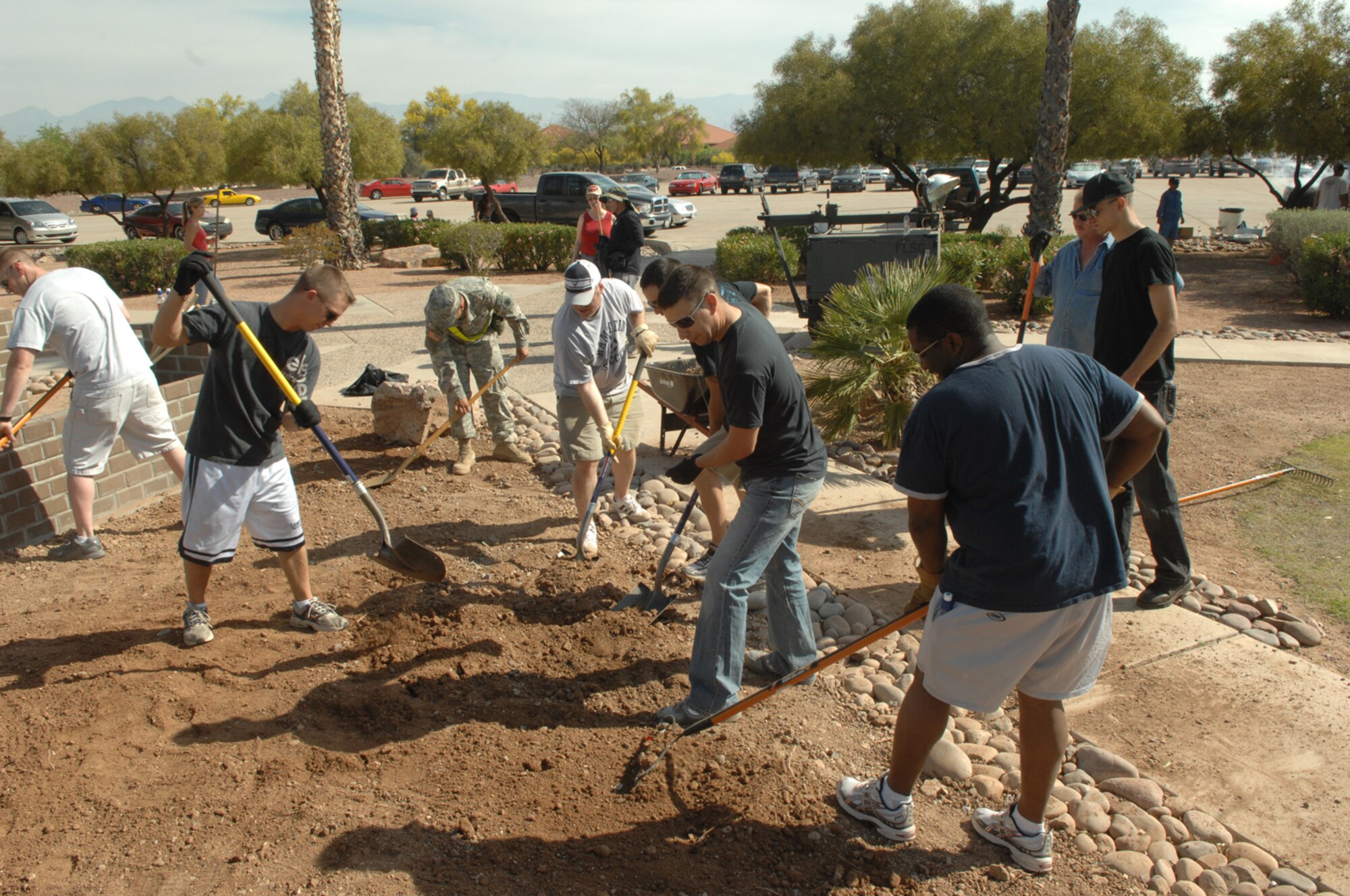 Members of the D-M community joined together to clean up Heritage Park April 19 in preparation of the 355th Fighter Wing Reunion. More than 400 D-M members and their families volunteered to clean up the park. After the park was clean, the D-M 1st Sergeants grilled burgers and hot dogs for all the volunteers. (U.S. Air Force photo by Senior Airman Alesia Goosic)  