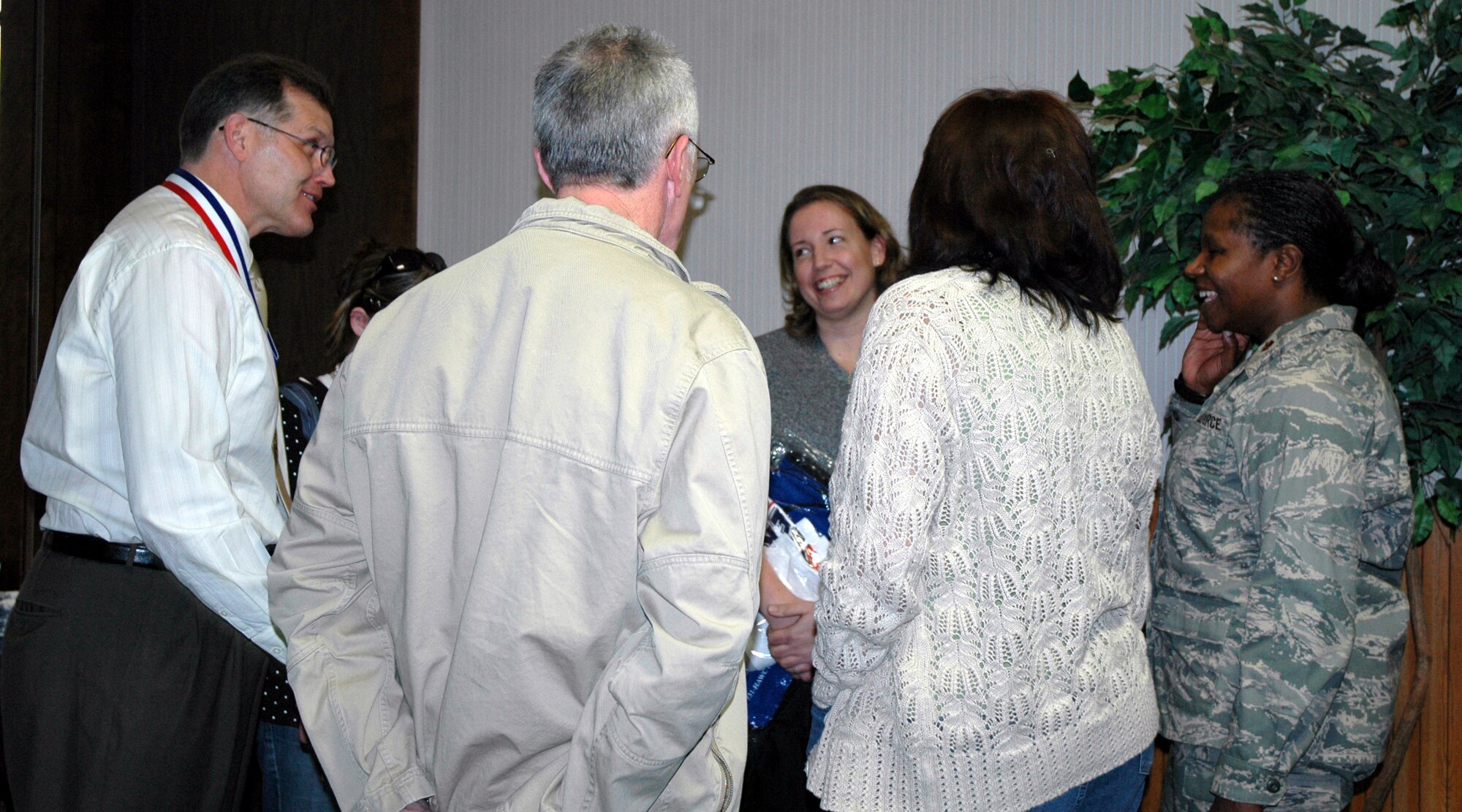 Season three's Largest Loser winner Jerry Kain (far left) shares a lighter moment with his runner-up and close second-place finisher Susan Smith (middle) after the announcement of the winners was made. Mr. Kain lost 31.50 pounds and Mrs. Smith lost 30.10 pounds. Also pictured are Mrs. Smith's daughter, Roger and Pam Barnes, and Maj. Rosalyn Walker, 341st Services Squadron commander. (U.S. Air Force photo/Valerie Mullett)