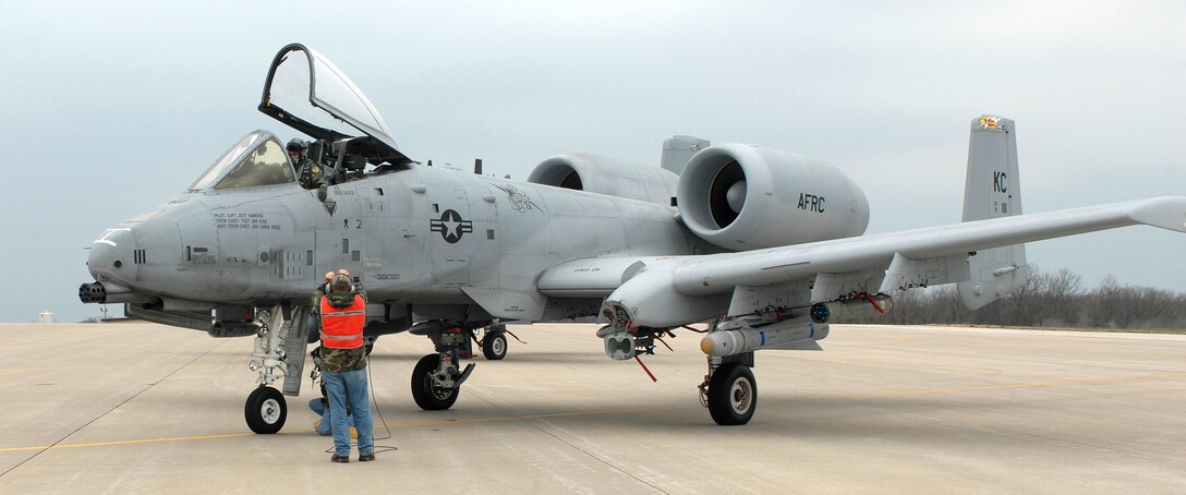 Tech. Sgt. Brian Gillespie, 442nd Aircraft Maintenance Squadron, gives the pilot of an A-10 hand signals while Senior Airman Robert Bagby, 442nd AMXS performs a cursory check of the aircraft prior to take-off April 17. The 442nd Fighter Wing is an Air Force Reserve unit at Whiteman Air Force Base, Mo. (U.S. Air Force photo/Tech. Sgt. Samuel A. Park)
