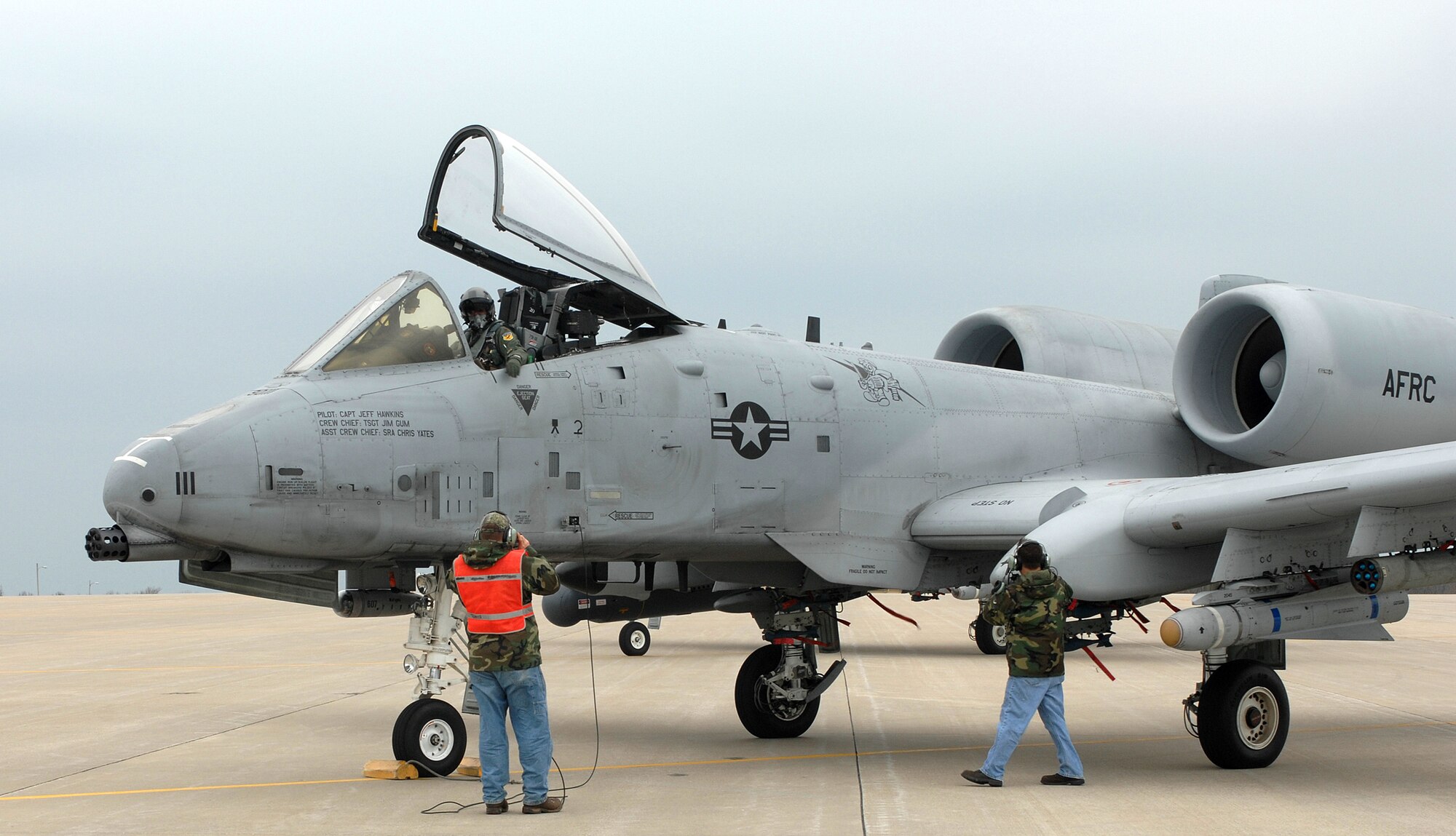 Tech. Sgt. Brian Gillespie, 442nd Aircraft Maintenance Squadron, gives the pilot of an A-10 hand signals while Senior Airman Robert Bagby, 442nd AMXS performs a cursory check of the aircraft prior to take-off April 17. The 442nd Fighter Wing is an Air Force Reserve unit at Whiteman Air Force Base, Mo. (U.S. Air Force photo/Tech. Sgt. Samuel A. Park)