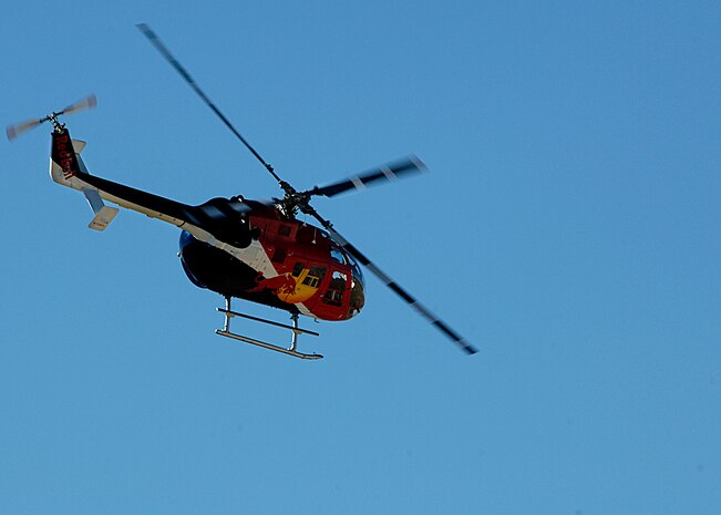 The Red Bull stunt helicopter performs at Holloman AFB, N.M., Oct. 26, 2007. The Red Bull aerobatic stunt helicopter is the one and only aerobatic helicopter show in North America. It is piloted by Chuck Aaron, who is the only pilot licensed in the U.S. by the Federal Aviation Administration to fly aerobatics in a helicopter. (U.S. Air Force photo/Airman 1st Class John Strong II)
