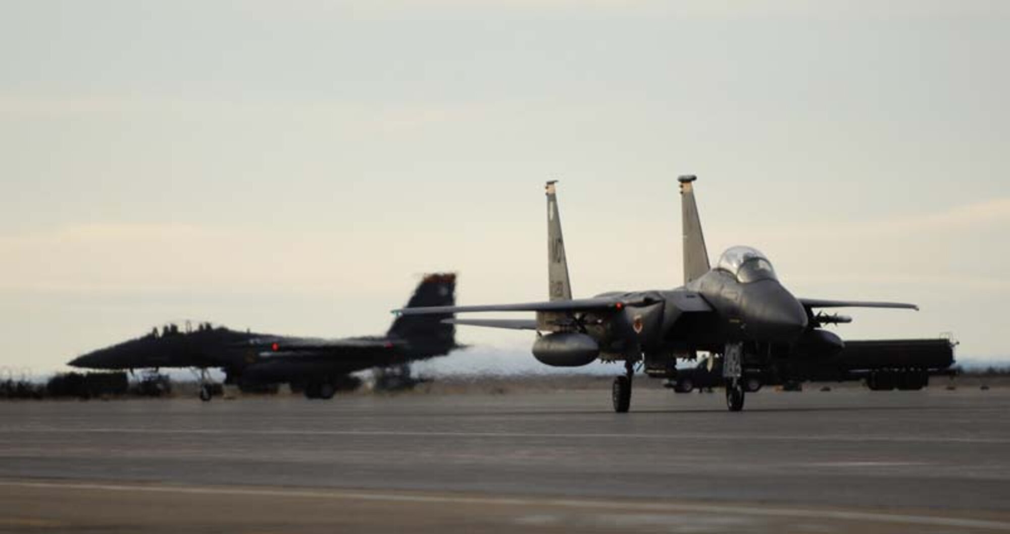 MOUNTAIN HOME AIR FORCE BASE, Idaho -- Two F-15E Strike Eagles from the 389th Fighter Squadron taxi down the flightline after returning from a mission in the simulated deployed location during Exercise Coronet White 08-ACC-14 March 17. (U.S. Air Force photo/ Airman 1st Class Ryan Crane)