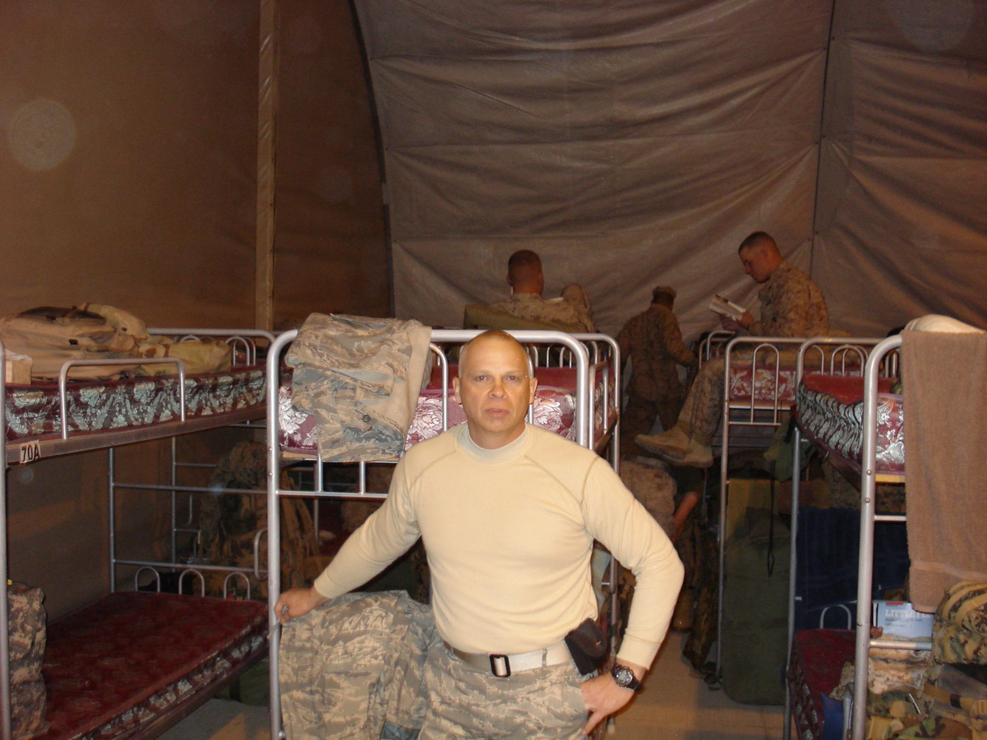 KABUL AIR BASE, Afghanistan -- Senior Master Sgt. Mark Stolar takes a picture of his living quarters while deployed to Kabul. Sergeant Stolar is a structural superintendent with the 916th Civil Engineer Squadron. He volunteered for a year's tour in Afghanistan.