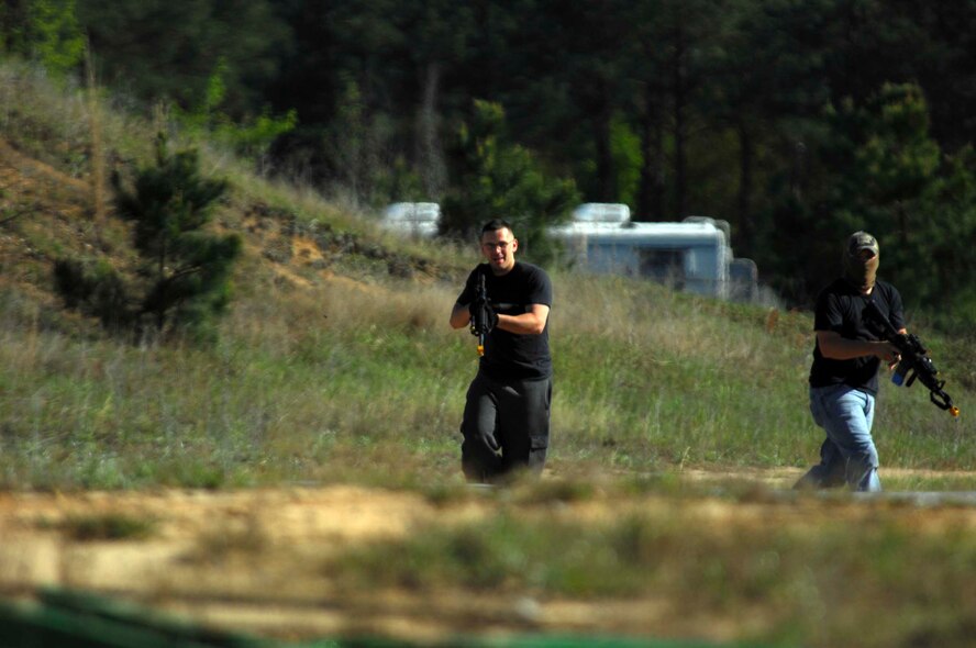 SHAW AIR FORCE BASE, S.C.-- Airmen from the 20th Security Forces Squadron act as opposing forces toward a convoy April 16. These Airmen are part of Iron Thunder, an Excercise for the 77th Fighter Squadron pilots and other operating units to train for close air support missions. (U.S. Air Force photo/Airman 1st Class Matthew Davis)