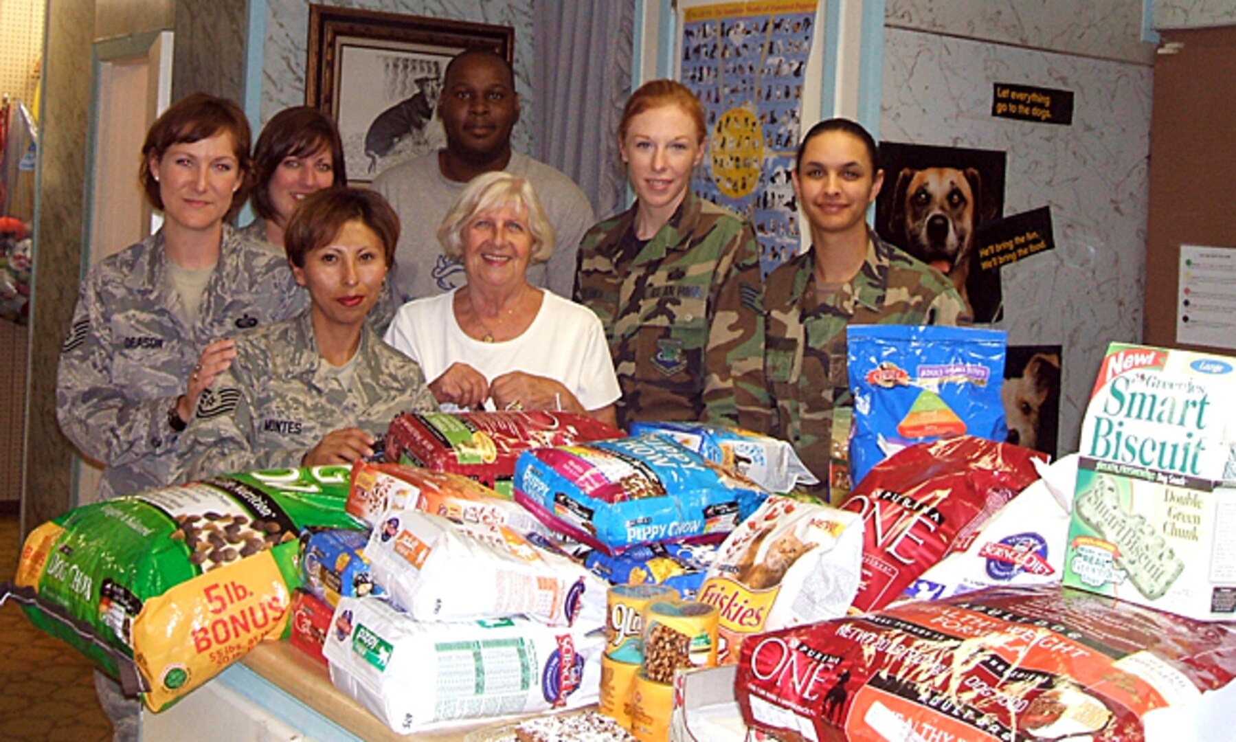 Members of the Air Force Personnel Center Junior Enlisted Council show off some of the donations raised recently to support the Universal City Animal Shelter. The council raised 756 pounds of food, 224 pounds of cat litter, 16 pounds of treats and $155. Front row, from left: Tech. Sgt. Sara Montes and Aina Blake; back row, from left: Tech. Sgt. Sandra Deason, Staff Sgt. Tonya Posey, Sharod White, Staff Sgt. Simona Patrick and Senior Airman Janina-Eva White. (Courtesy photo)