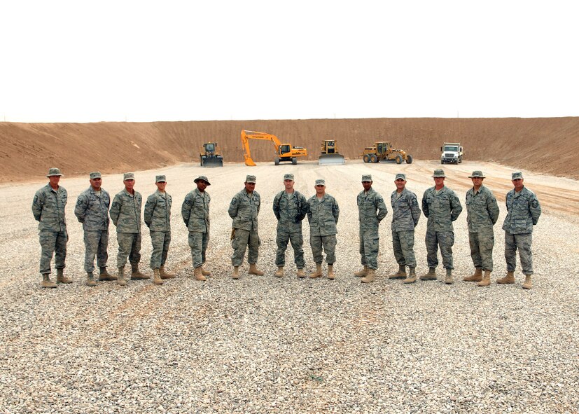 SEYMOUR JOHNSON AIR FORCE BASE, N.C. -- Capt. Chris Woofter (center) stands with the team that built a new small arms range at Kirkuk Air Base,  Iraq.  Capt. Woofter is the range designer.  He is
a Reservist with the 916th Civil Engineer Squadron and serves as the engineering flight commander.  
