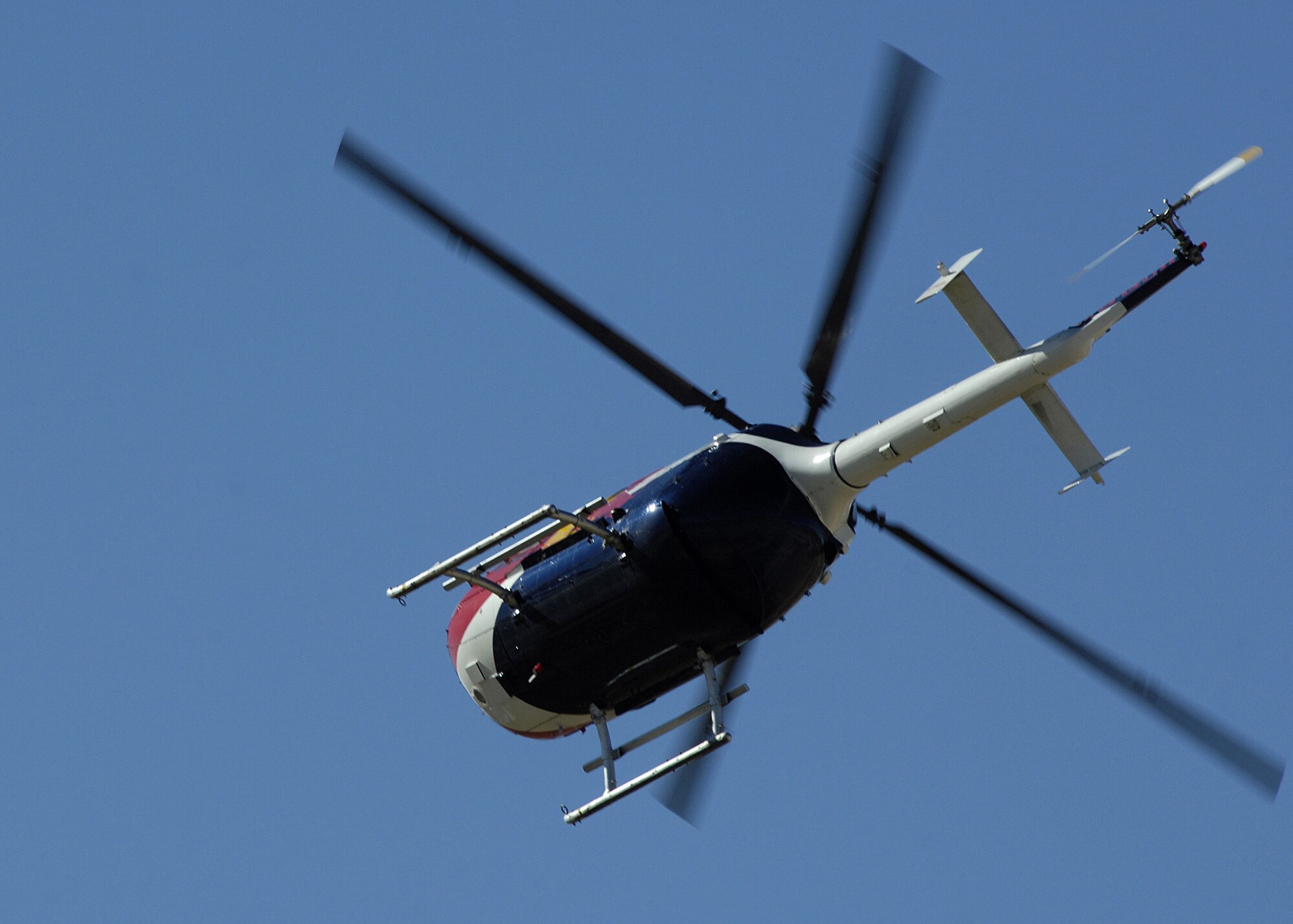 The Red Bull stunt helicopter performs at Holloman AFB, N.M., Oct. 26, 2007. The Red Bull aerobatic stunt helicopter is the one and only aerobatic helicopter show in North America. It is piloted by Chuck Aaron, who is the only pilot licensed in the U.S. by the Federal Aviation Administration to fly aerobatics in a helicopter. (U.S. Air Force photo/Airman 1st Class John Strong II)