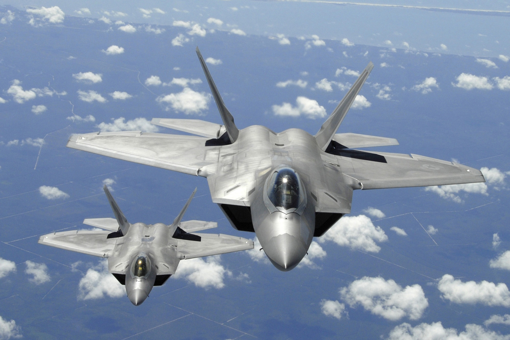 Two Air Force F-22 Raptor aircraft fly a training mission off the coast of Florida April 2, 2007. The Air Force's newest fighter aircraft, the F-22 Raptor, will demonstrate its combat capabilities at the 2008 "Wings Over Charleston" Air Expo. (Department of Defense photo/Senior Master Sgt. Thomas Meneguin)
