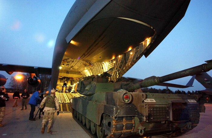 Ground crews load a tank onto a Charleston C-17 Globemaster III at Ramstein AB, Germany. The 437th Airlift Wing is currently flying the C-17A Globemaster III in support for Operations Iraqi and Enduring Freedom. C-17s have been a part of thousands of missions performed every year since delivery to Charleston AFB in 1993. (U.S. Air Force photo by Master Sgt. Keith Reed)