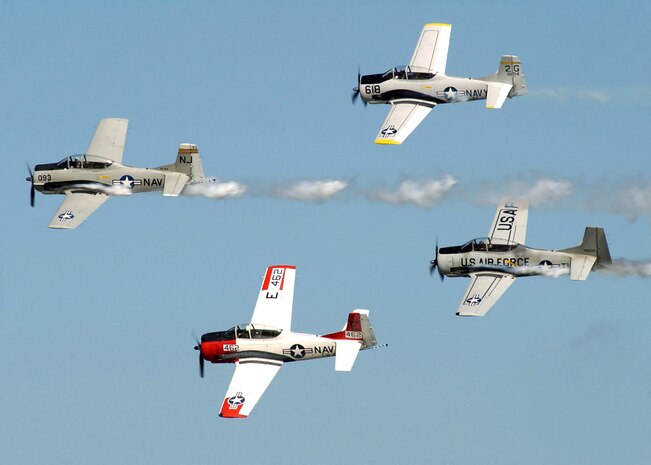The T-28 Warbird Aerobatic Formation Demonstration Team, the Trojan Horsemen, perform at the 2004 Naval Air Station Oceana Air Show, Va.  The T-28 Warbird Dixie Demonstration Team will fly in formation in their vintage 1939 aircraft. There will be four aircraft from the Dixie Wing at the 2008 "Wings Over Charleston" Air Expo. (U.S. Navy photo/Petty Officer 2nd Class Scott Campbell)