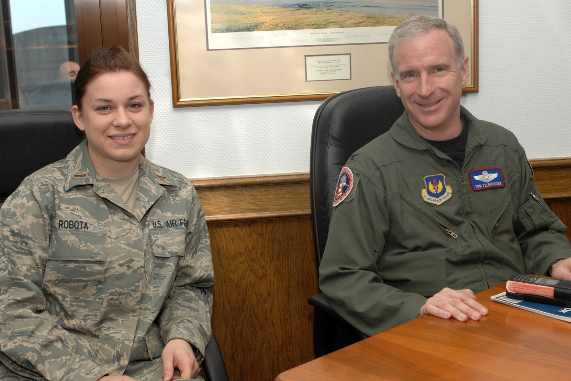 SPANGDAHLEM AIR BASE, Germany – 1st Lt. Emily Robota, 52nd Equipment Maintenance Squadron, talks with Col. Thomas Feldhausen, 52nd Fighter Wing commander, April 16, 2008. Lieutenant Robota spent the day with Colonel Feldhausen as part of the Commander’s Shadow program. She is a native of Tulsa, Okla. (U.S. Air Force photo/Airman 1st Class Jenifer Calhoun) 