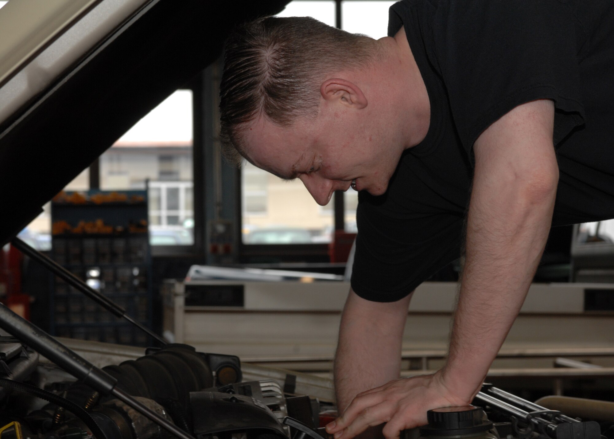 SPANGDAHLEM AIR BASE, Germany – Tech. Sgt. Nathan Nielsen, 52nd Logistics Readiness Squadron, works on a truck at the vehicle maintenance shop April 14, 2008. Vehicle maintenance is one of the many shops here that has turned to the Air Force Smart Operations for the 21st Century program to elevate the strain of low manning through more efficient operations. (U.S Air Force photo/Airman 1st Class Jenifer Calhoun)