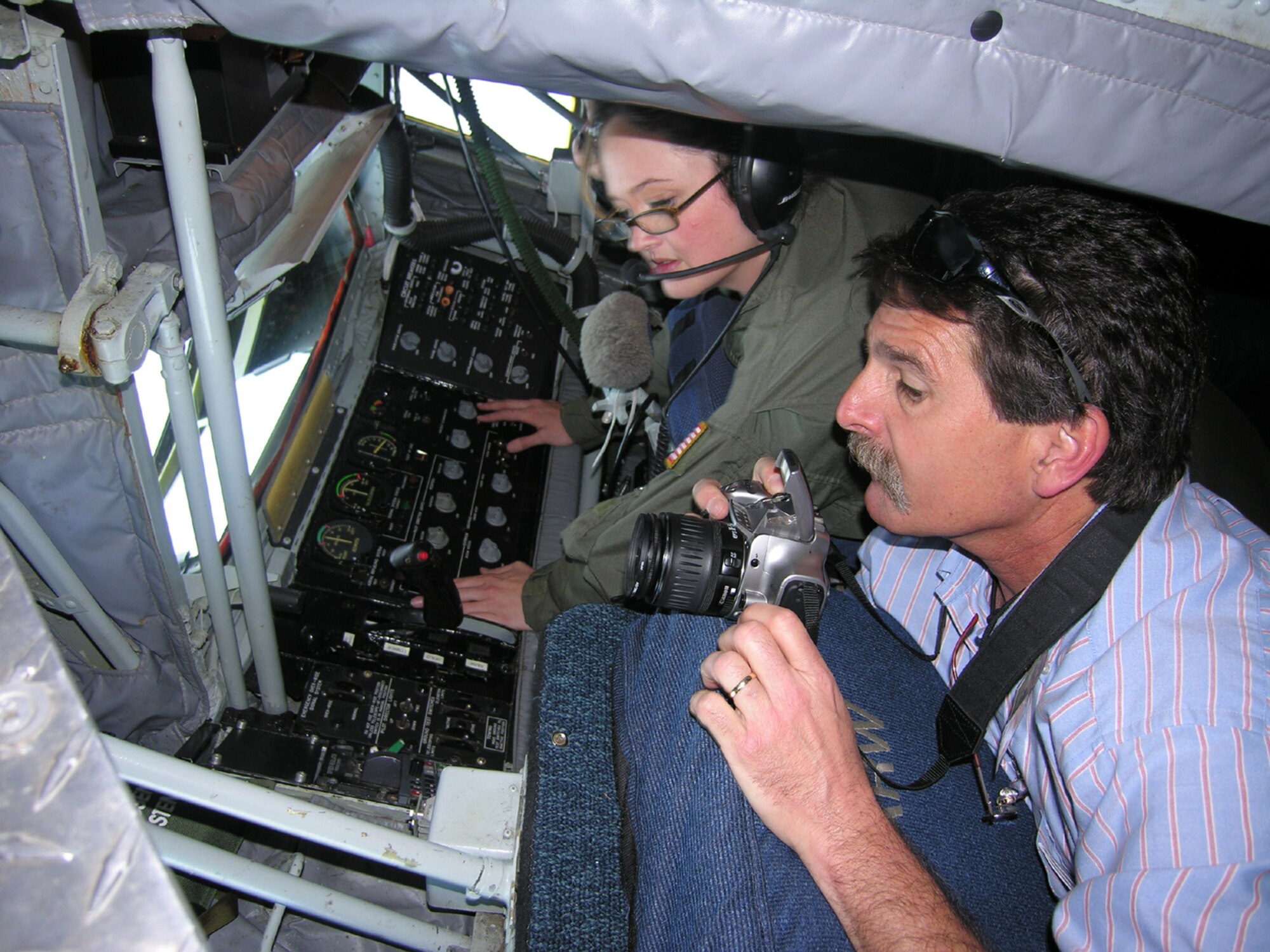 SEYMOUR JOHNSON AIR FORCE BASE, N.C. -- Tech. Sgt. Tara Hopewell (right) demonstrates the capabilities of the KC-135R Stratotanker to a local civic leader during an air-to-air refueling flight last week. More than 50 community leaders from the Leadership Wayne County class and others from across the state participated in the Reserve wing's community outreach program. The 916th Air Refueling Wing refueled F-15E Strike Eagles from the 4th Fighter Wing. The 916th ARW runs the most active flight orientation program in the Air Force Reserve, educating nearly 250 community leaders and ROTC cadets each year. U.S. Air Force photo/Ms. Donna Lea