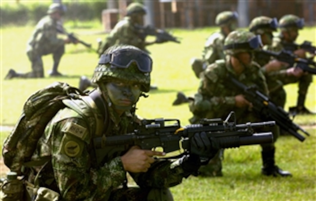 Colombian special forces show counter insertion tactics to participants of the 75th Joint Civilian Orientation Conference outside Bogota, Colombia, April 22, 2008. 