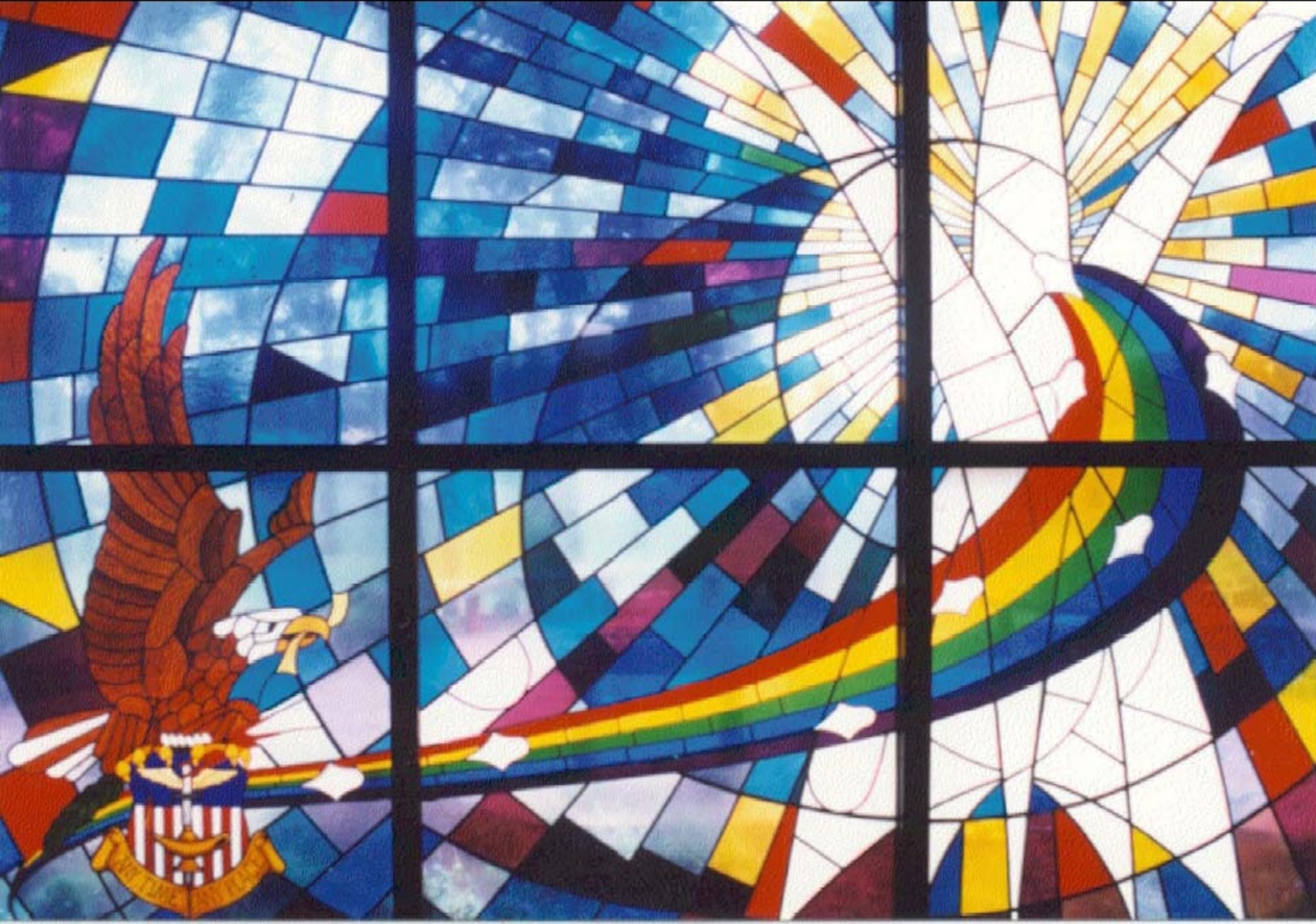 This stained glass window is the centerpiece of a memorial at the entrance of the Hurlburt Field Chapel honoring fallen members of the 1st Special Operations Wing. In the window are eight diamonds representing the eight military members who died in Operation Eagle Claw. (Courtesy photo)