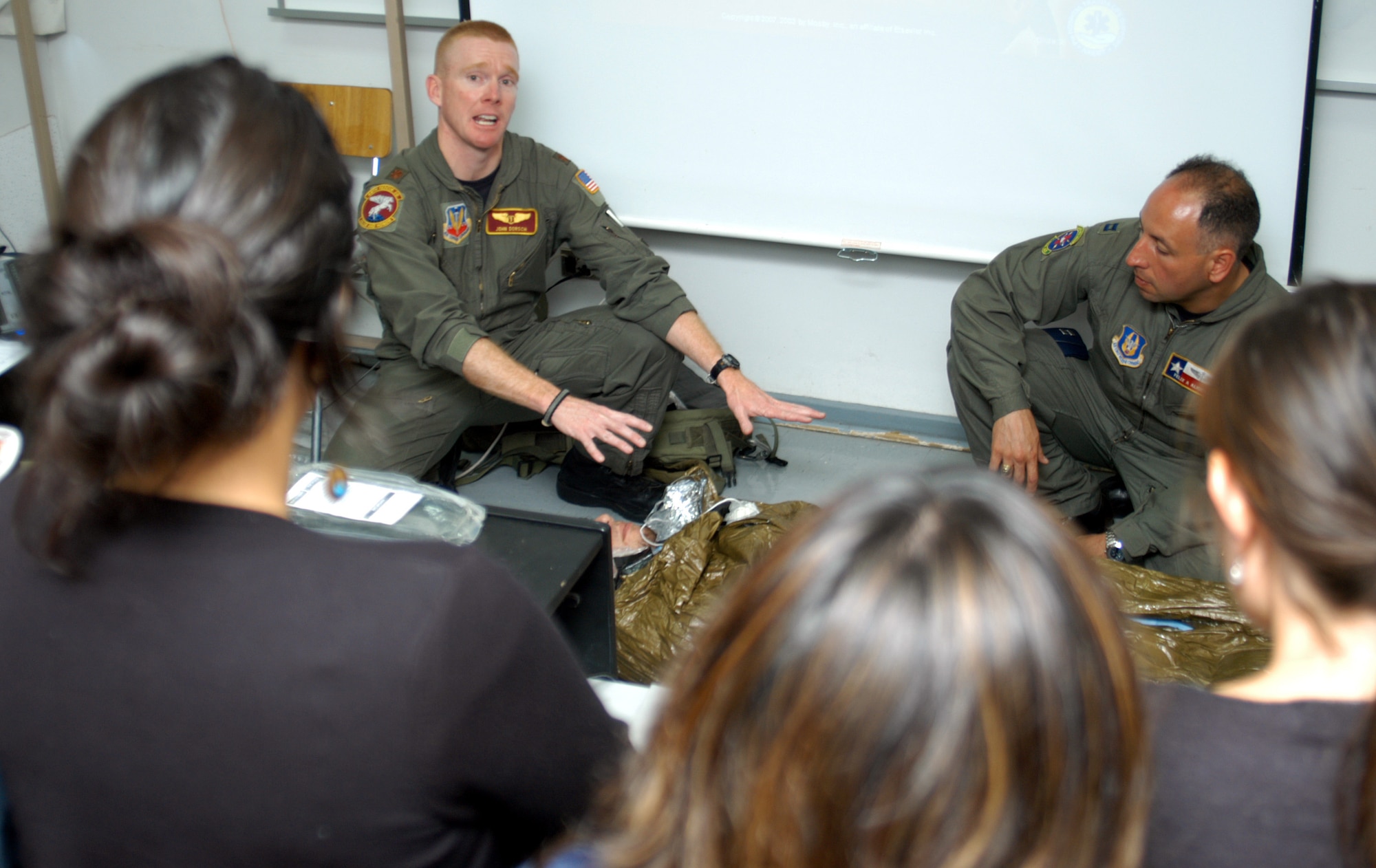 SANTIAGO, Chile -- Maj. (Dr.) John Dorsch and Capt. Felix Alicea, a flight nurse, discuss abdominal injuries with a group of nurses and medical technicians at a Chilean air force hospital April 4. The visit happened as a result of FIDAE 2008 and Exercise Newen 2008.  The exercise emphasized cooperation and partnership between the U.S. and Chilean militaries.  (U.S. Air Force photo/Master Sgt. Jason Tudor)