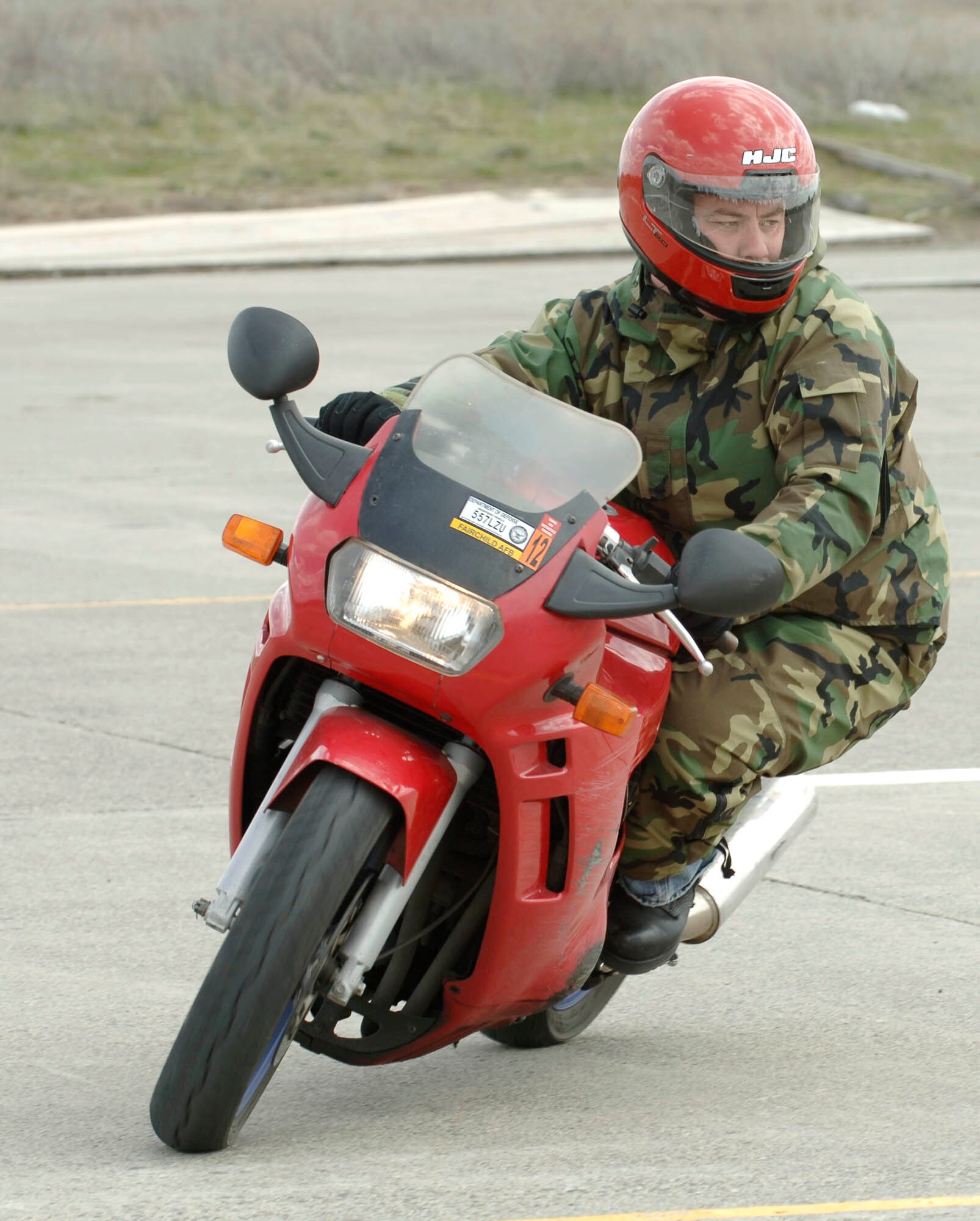 FAIRCHILD AIR FORCE BASE, Wash. – Master Sgt. Steven Stephens, 92nd Air Maintenance Squadron production supervisor, rides his red ’94 Suzuki bike during the sports bike training on April 22.  The sports bike training teaches bike riding fundamentals to become instructor certified. (U.S. Air Force photo / Staff Sergeant JT May III)