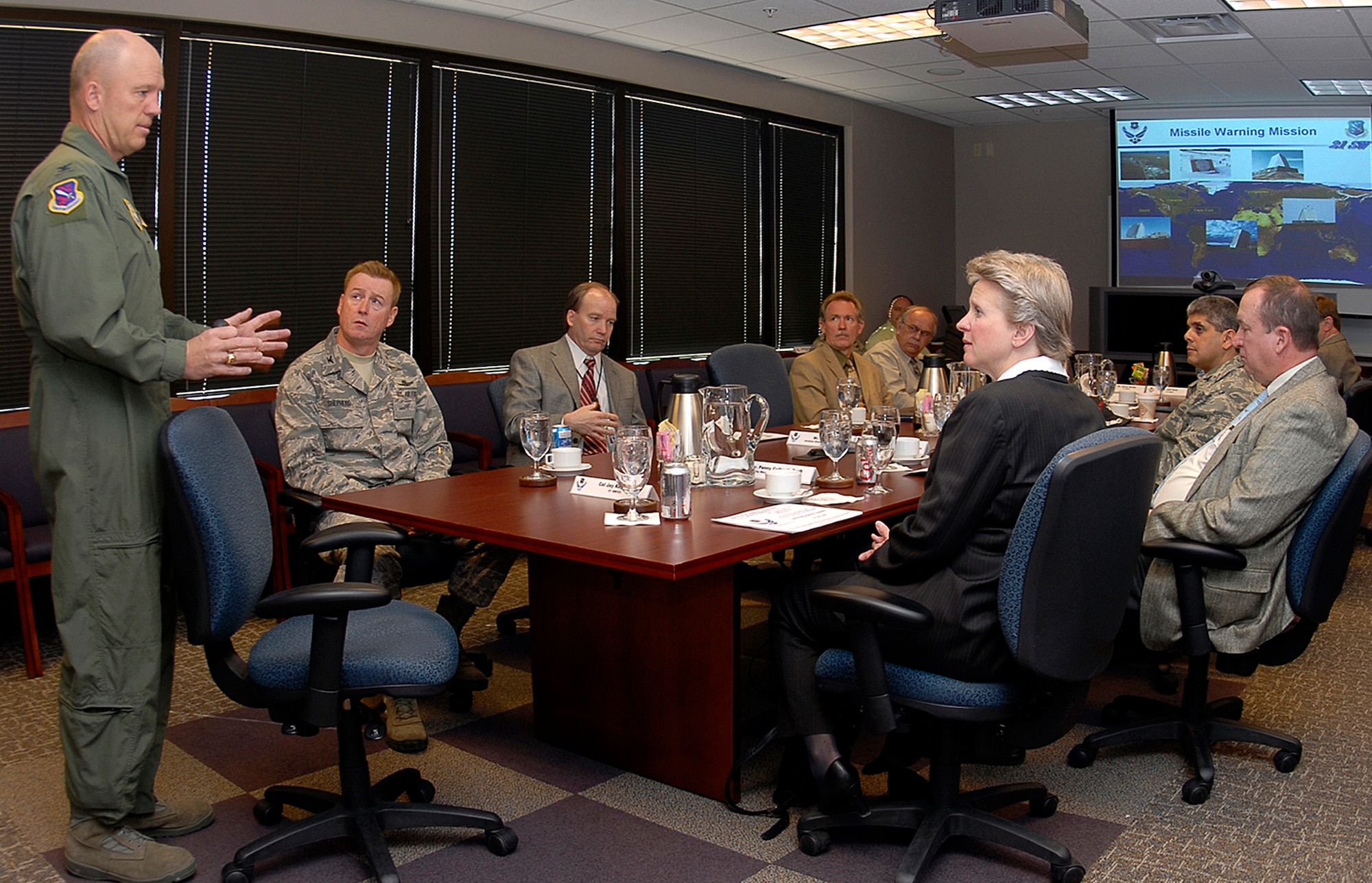 Col. Jay Raymond, 21st Space Wing commander (left), provides a wing mission brief to Dr. Penelope Culbreth-Graft April 24 during a visit to Peterson Air Force Base, Colo.  Dr. Culbreth-Graft, who recently became the new Colorado Springs city manager, was introduced to the base and its mission to gain a better understanding of how the city and Peterson work together. The doctor was also introduced to Peterson’s BluePrint-2050 development plan and was provided a tour of the installation. (U.S. Air Force photo/Rob Bussard)