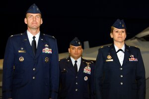 LANGLEY AIR FORCE BASE, Va. -- Col. Brian Yolitz, previous 1st Mission Support Group commander, stands at attention with Lt. Col. Thomas Goulter Jr., 1st Services Squadron commander and Maj. Caroline Miller, previous 1st Mission Support Squadron commander and new 1st Force Support Squadron commander, during the 1st FSS activation ceremony here April 22. The new squadron, totaling 800 people, is a result of the 1st MSS and 1st SVS merger. (U.S. Air Force photo/Airman 1st Class Gul Crockett)