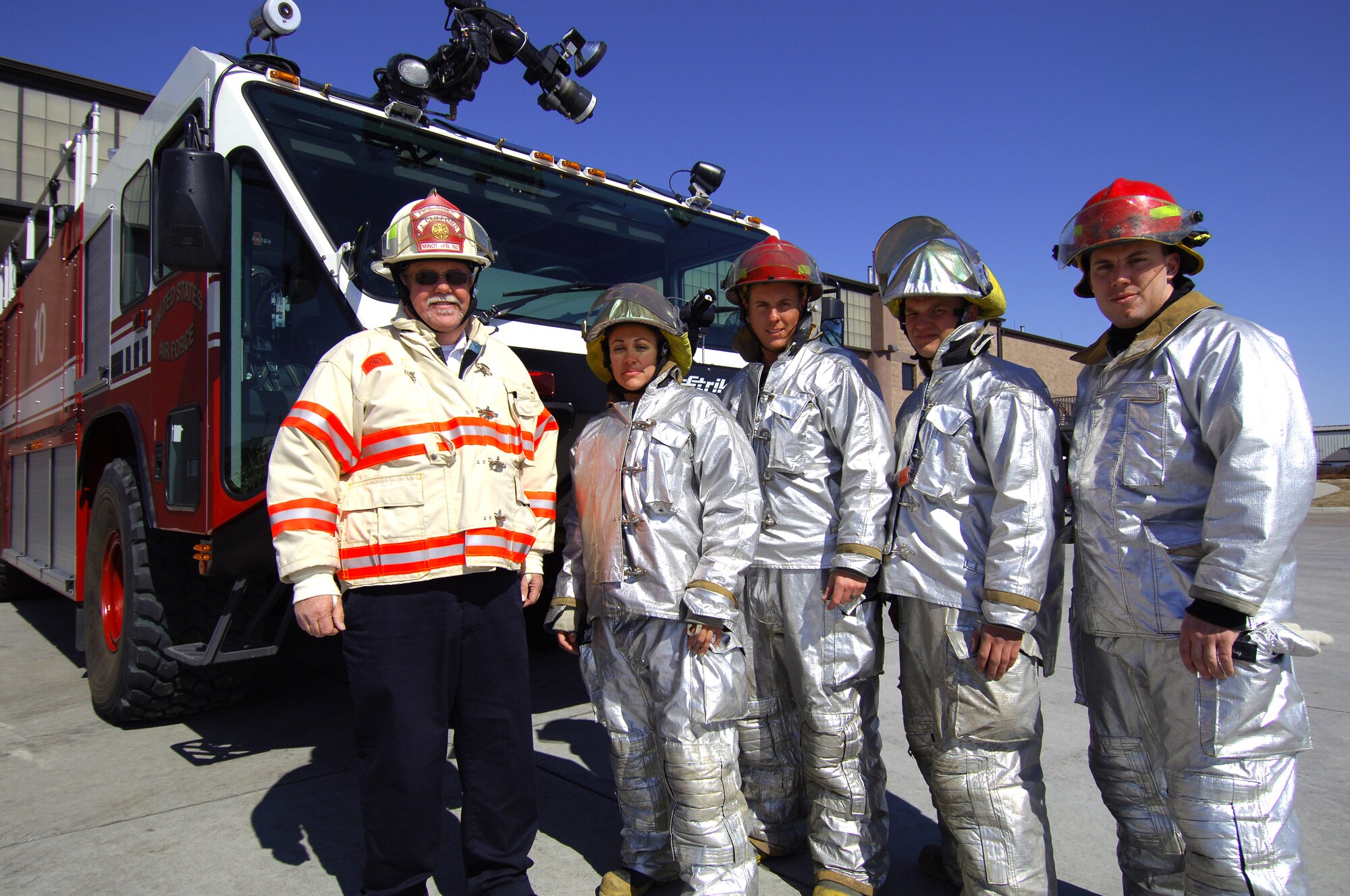 MINOT AIR FORCE BASE, N.D. -- Five firefighters from the 5th Civil Engineer Squadron here saved the lives of two local firefighters while battling a wild-fire April 19 in Trestle Valley.  In addittion to responding to emergencies on base, Minot AFB firefighters also render aid to the local community. (U.S. Air Force photo by Airman 1st Class Kelly Timney)