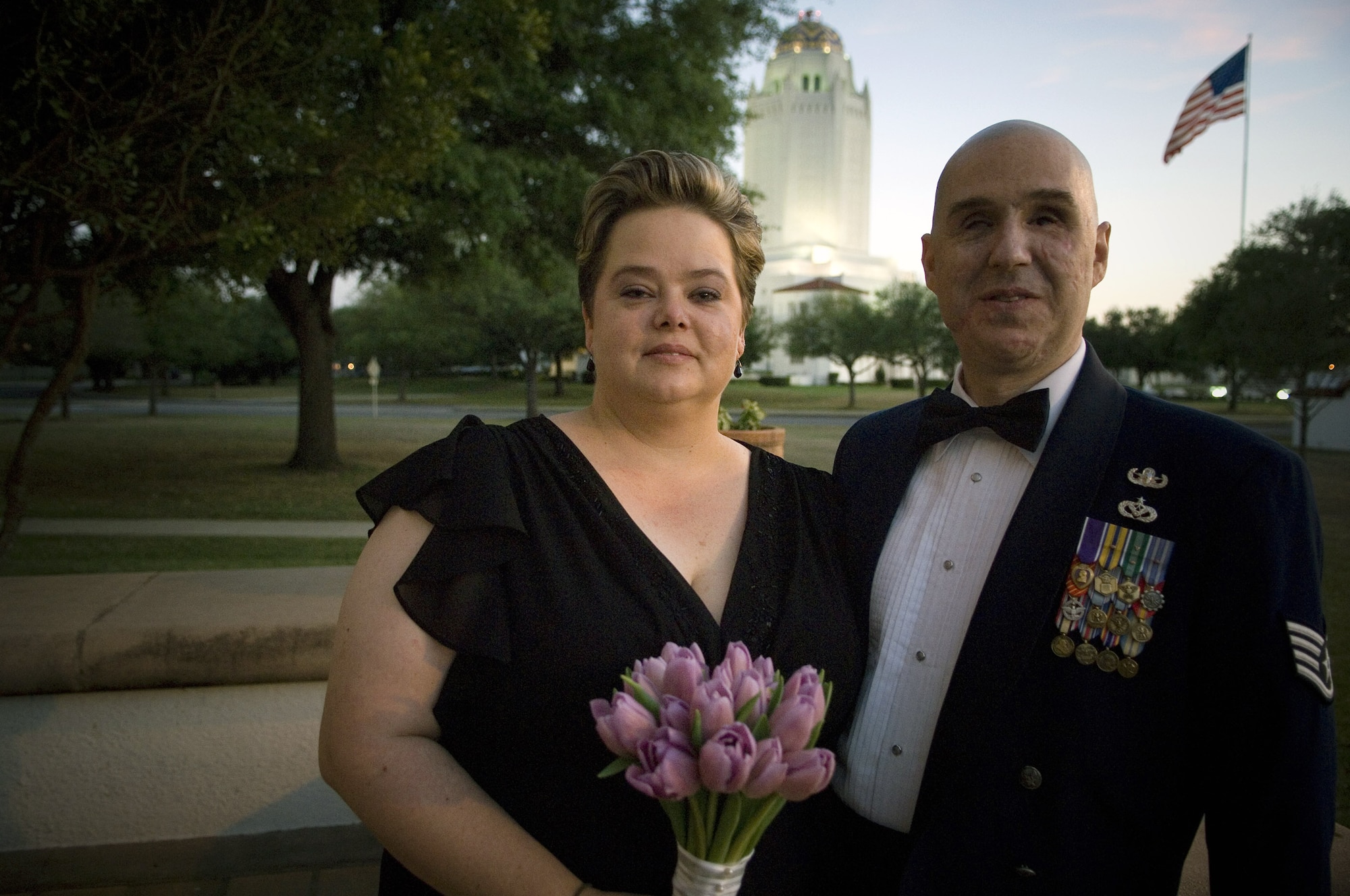 Staff Sgt. Matthew Slaydon and his wife, Annette, pause outside the Randolph Air Force Base, Texas, chapel at their wedding vow renewal ceremony April 12. Sergeant Slaydon was critically wounded by a terrorist bomb in Iraq in October 2007. His wife and a host of Air Force members at Randolph and his home station of Luke Air Force Base, Ariz., have helped Sergeant Slaydon focus on recovery. (U.S. Air Force photo/Tech. Sgt. Matthew Hannen) 