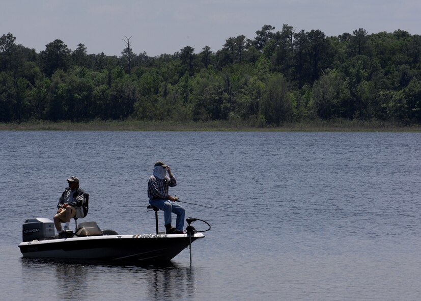 MOODY AIR FORCE BASE Ga. --Two men fish from their boat while at Grassy Pond, near Moody AFB, April 23. Grassy Pond is a 500-acre recreation area with a 275-acre pond that has 17 cabins, 39 RV and tent sites, four group shelters and a recreational boating area. (U.S. Air Force photo by Airman 1st Class Brittany Barker) 