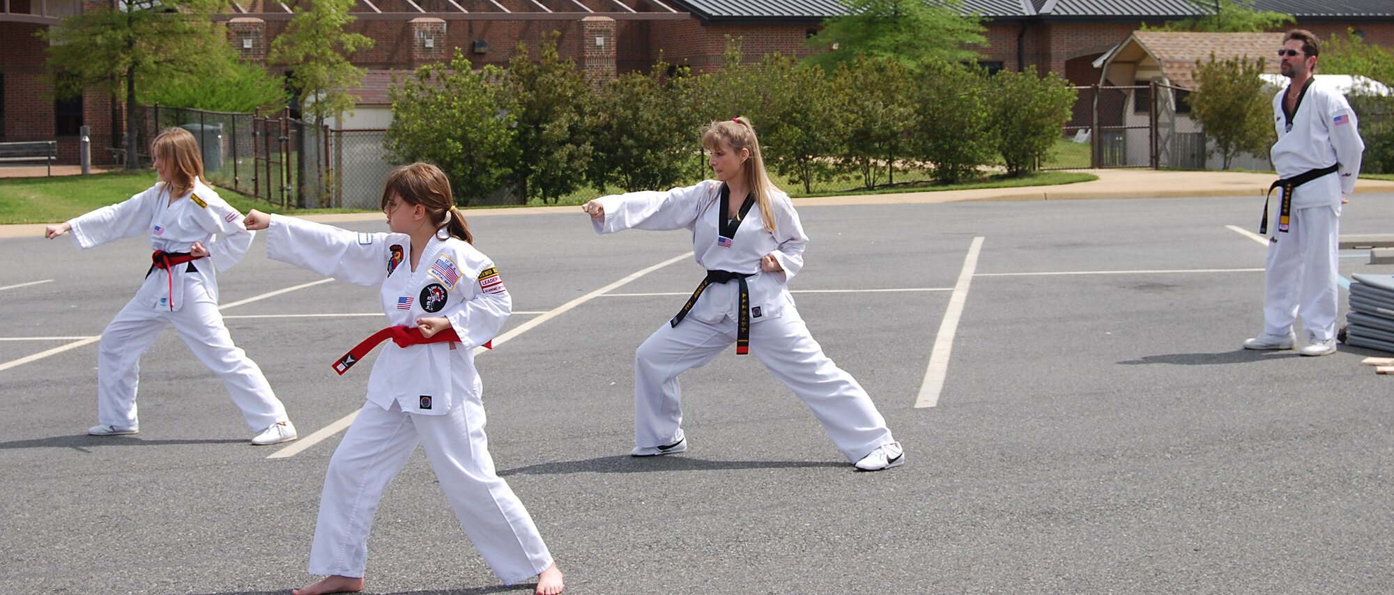 LANGLEY AIR FORCE BASE, Va. -- The Tae Kwon Do group from the Langley Community Center demonstrated some moves at KidsFest here April 19. More than 800 children and adults attended this year's Kidfest, an annual celetration honoring military children and their families with games, prizes, food and entertainment. Tae Kwon Do classes meet Tuesdays and Thursdays from 7 to 8:30 p.m. at the community center. The cost is $35 a month. (U.S. Air Force photo/Staff Sgt. Misty D. Slater)