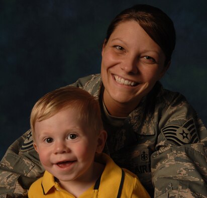 WHITEMAN AIR FORCE BASE, Mo.--Tech. Sgt. Kristy Earls, an Airman Leadership School instructor, poses with her son, Jackson, April 23. Sergeant Earls was recently recognized for saving the life of a young boy by performing the Heimlich maneuver. She states that as a mother she tries to always be prepared for certain situations. (U.S. Air Force photo/Senior Airman Stephanie Clark)