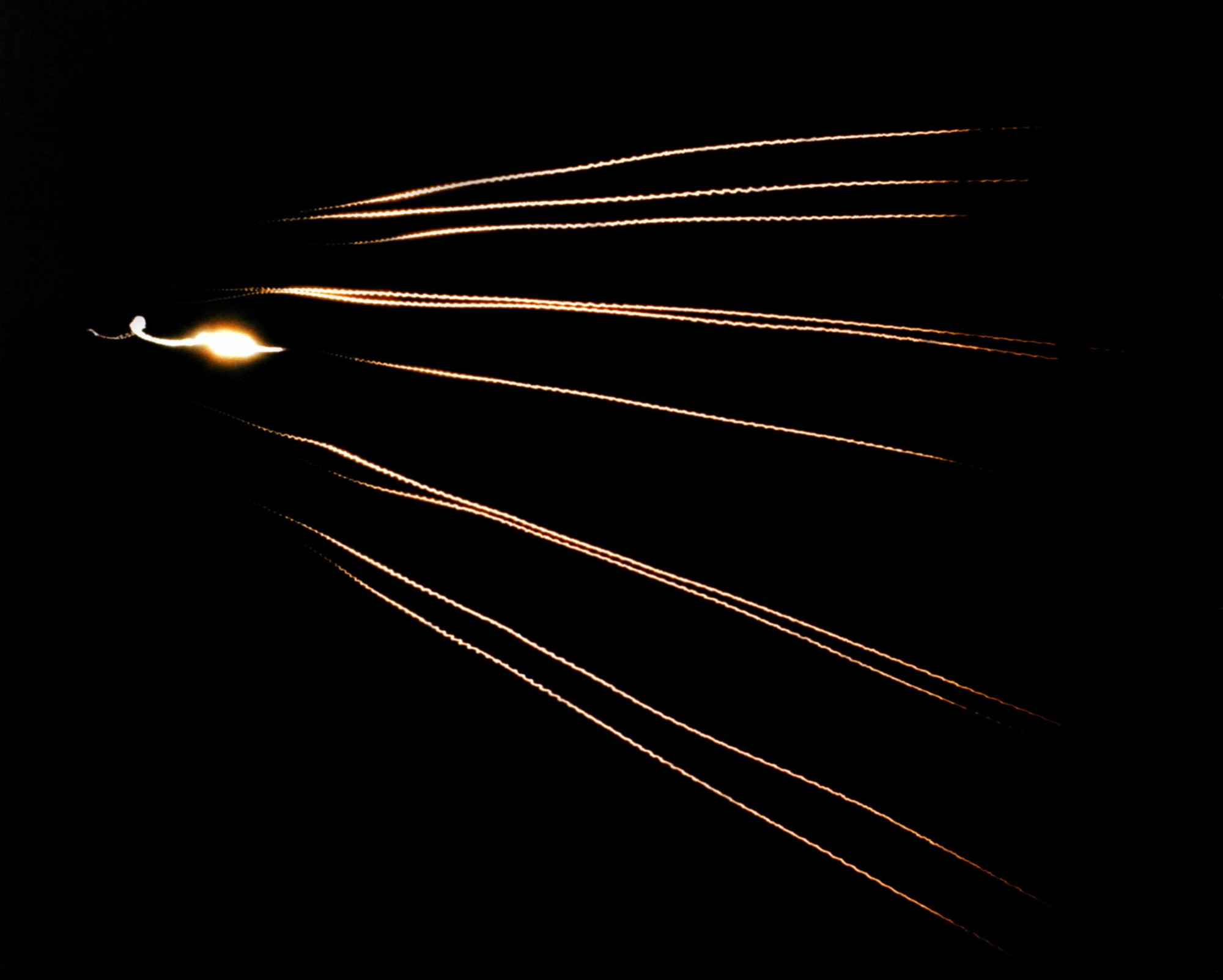 The MIRV warhead of the Peacekeeper made it a very powerful weapon. This timed exposure shows 10 MK-21 re-entry vehicles approaching an open-ocean impact zone near Kwajalein Atoll during a flight test. (U.S. Air Force photo)