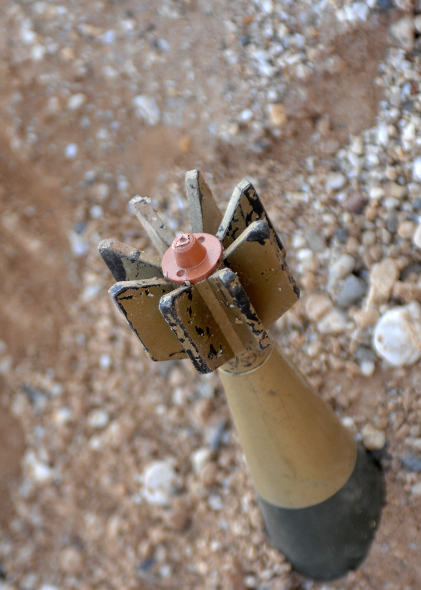 SPANGDAHLEM AIR BASE, Germany -- A mortar sits buried in dirt at one of the many exercise sites at the Ability to Survive and Operate Rodeo during the base wide exercise Operation Saber Crown 08-06 April 23, 2008. Participants in this exercise had to locate and identify various types of unexploded ordnances as well display all safety and alert precautions. (U.S. Air Force photo/ Airman 1st Class Jenifer Calhoun)