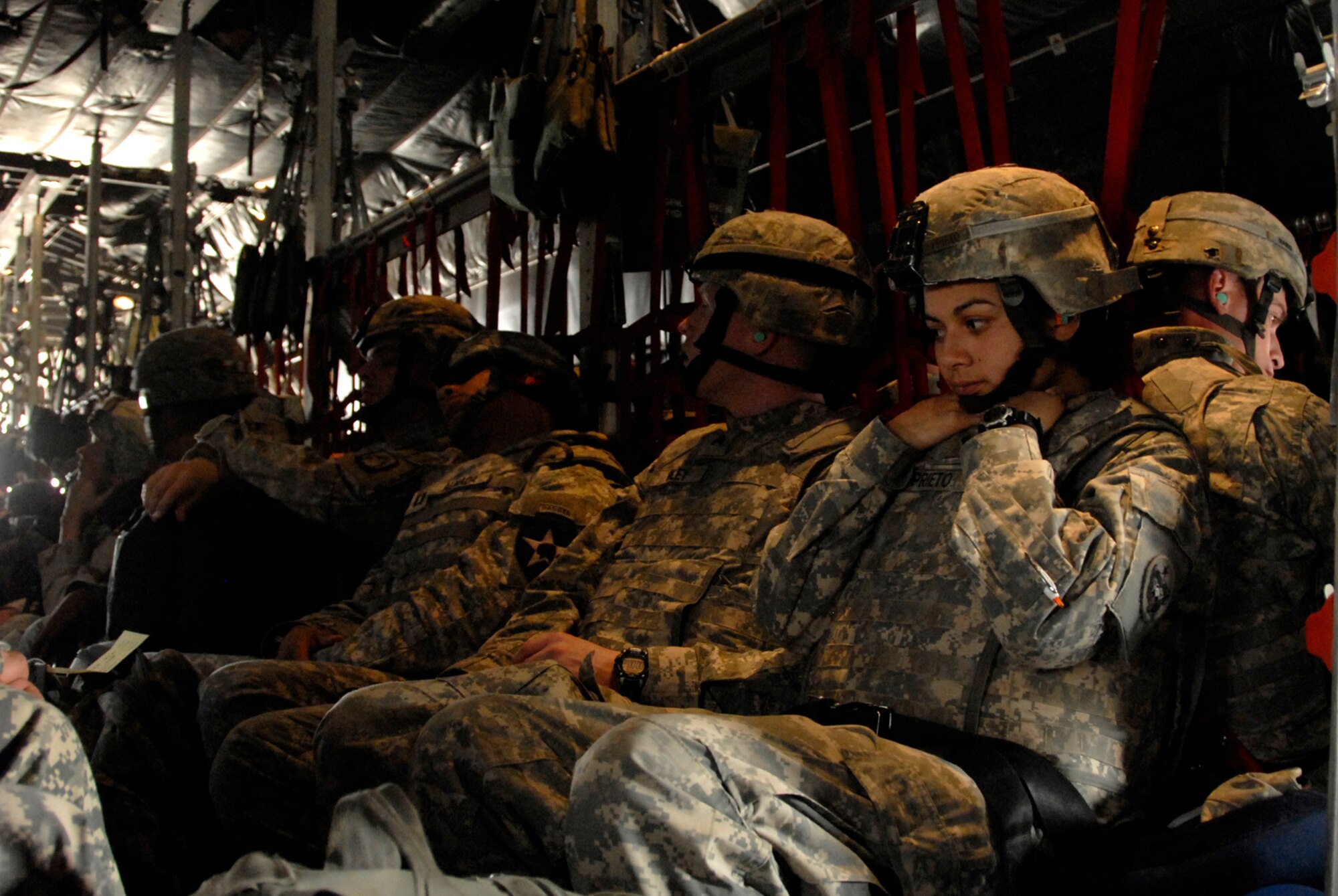 SOUTHWEST ASIA -- Soldiers fill up the seats of a U.S. Air Force C-130 Hercules during a combat sortie that is transported them into Iraq April 21, 2008, from an air base in the Persian Gulf Region. The Air Force recently surpassed more than one million sorties flown by Air Force aircraft in the Global War on Terror since Sept. 11, 2001. Synchronized and integrated into larger coalition air efforts, these missions represent the most deliberate, disciplined and precise air campaign in history. (U.S. Air Force photo/ Staff Sgt. Patrick Dixon)