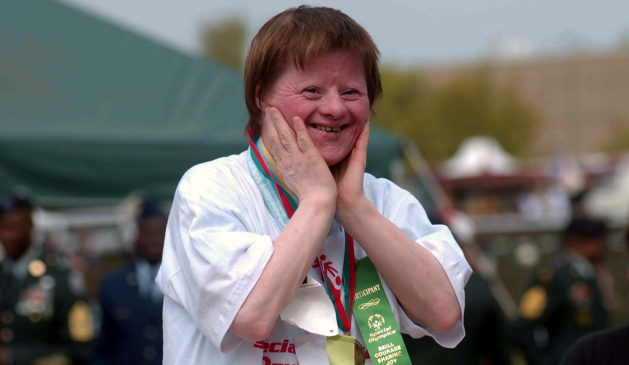 Marlene Belitz, from Tagesförderstätte Logo in Pirmasens, reacts to the crowd's applause after receiving a gold medal at the 2006 U.S. Army Garrison Kaiserslautern Special Olympics Spring Games at the Police Academy in Enkenbach-Alsenborn. This year's games will be held May 6 at the academy. Photo by Christine June 